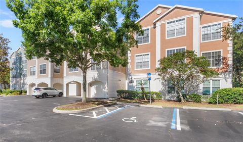 Photo of 12837 Madison Pointe Circle #206, Orlando, FL 32821 (MLS # O6311367)