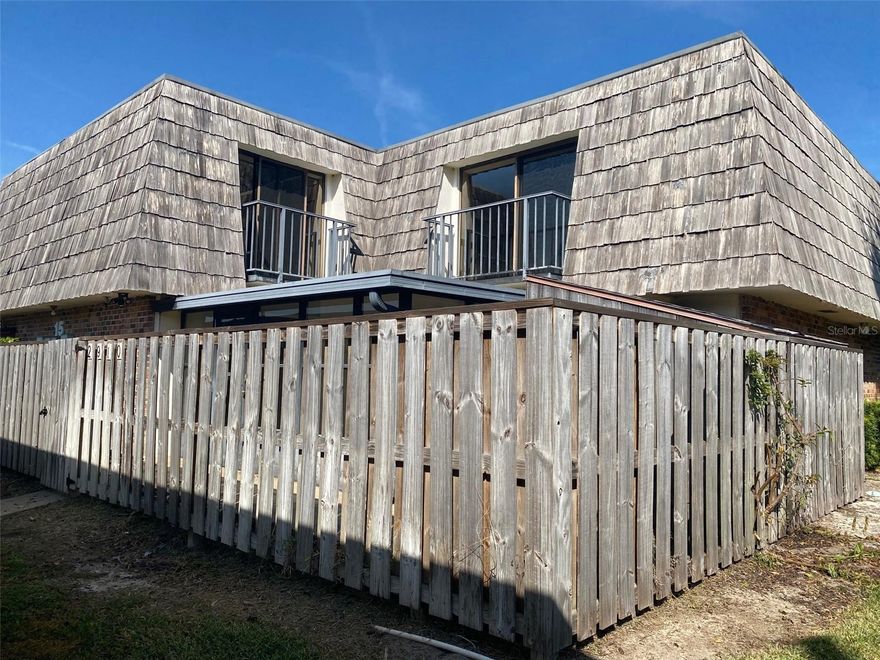 Quiet Gated community built amongst serene ponds with fountains and avian wildlife. The private upstairs living quarters has 2 bedrooms each with their own en-suite bath and a each with its own balcony. Downstairs is where you will find a tastefully updated kitchen with stainless steel appliances, bead-board ceiling, tract lighting with newer cabinets with ample counter space. Sliding glass doors from both the kitchen and the living room into the enclosed florida room and patio creates a flow space that welcomes entertaining. Also the guest half bath downstairs keeps guest out of your personal space upstairs. All appliances are included: Washer, dryer, dishwasher, side-by-side refrigerator, microwave, range.