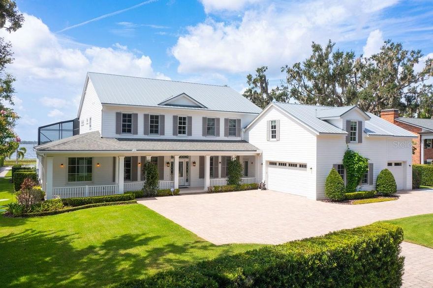 Nestled on one of the most coveted streets in Windermere awaits your new lakefront residence, meticulously designed to embrace the breathtaking views of Lake Butler. From the moment you step inside, the grandeur of this home unfolds, revealing a lavish family living area adorned with 24-foot sliding doors that lead to an expansive lanai. This outdoor masterpiece features a summer kitchen, a heated pool, and a delightful lounge area, seamlessly blending the boundaries between indoors and outdoors for a truly captivating experience. For those with a refined taste, a formal dining room, a game room, and a library provide ample space for entertainment. The European-style chef's kitchen, overlooking the pool, is a culinary haven in itself. Equipped with top-of-the-line appliances, a spacious walk-in pantry, and a breakfast bar with seating for up to eight, it is a delight for any culinary enthusiast. The downstairs laundry room, thoughtfully designed, offers a secondary entrance to the garage apartment, ensuring your guests' privacy and convenience. This apartment is a luxurious retreat within a luxurious home, featuring a living and dining area, a well-appointed galley kitchen, a large bedroom with a seating area, and a full bathroom. Journey to the second floor of the main home, where stunning lake views await you through floor-to-ceiling doors leading to a large balcony. The Owner's retreat is a sanctuary, boasting a spa-like bathroom with a soaking tub, a walk-in shower, contemporary dual vanities, and a spacious closet. Additionally, the upstairs offers three more bedrooms, two full baths, bonus room and an extra laundry room, creating a comfortable living space for your family or guests. A distinguished home office crowns this residence, accessed through its private entrance, ensuring both seclusion and convenience for your work or personal endeavors. As an added bonus, this home features a salt room and private dock on a massive backyard, making it the perfect respite. Lake life enthusiasts will relish the ease and convenience of launching into Lake Butler for paddle boarding, canoeing, jet skiing, or boating. This piece of paradise in the heart of Windermere is a rare gem, an embodiment of luxury living, and the epitome of Central Florida's finest lifestyle.