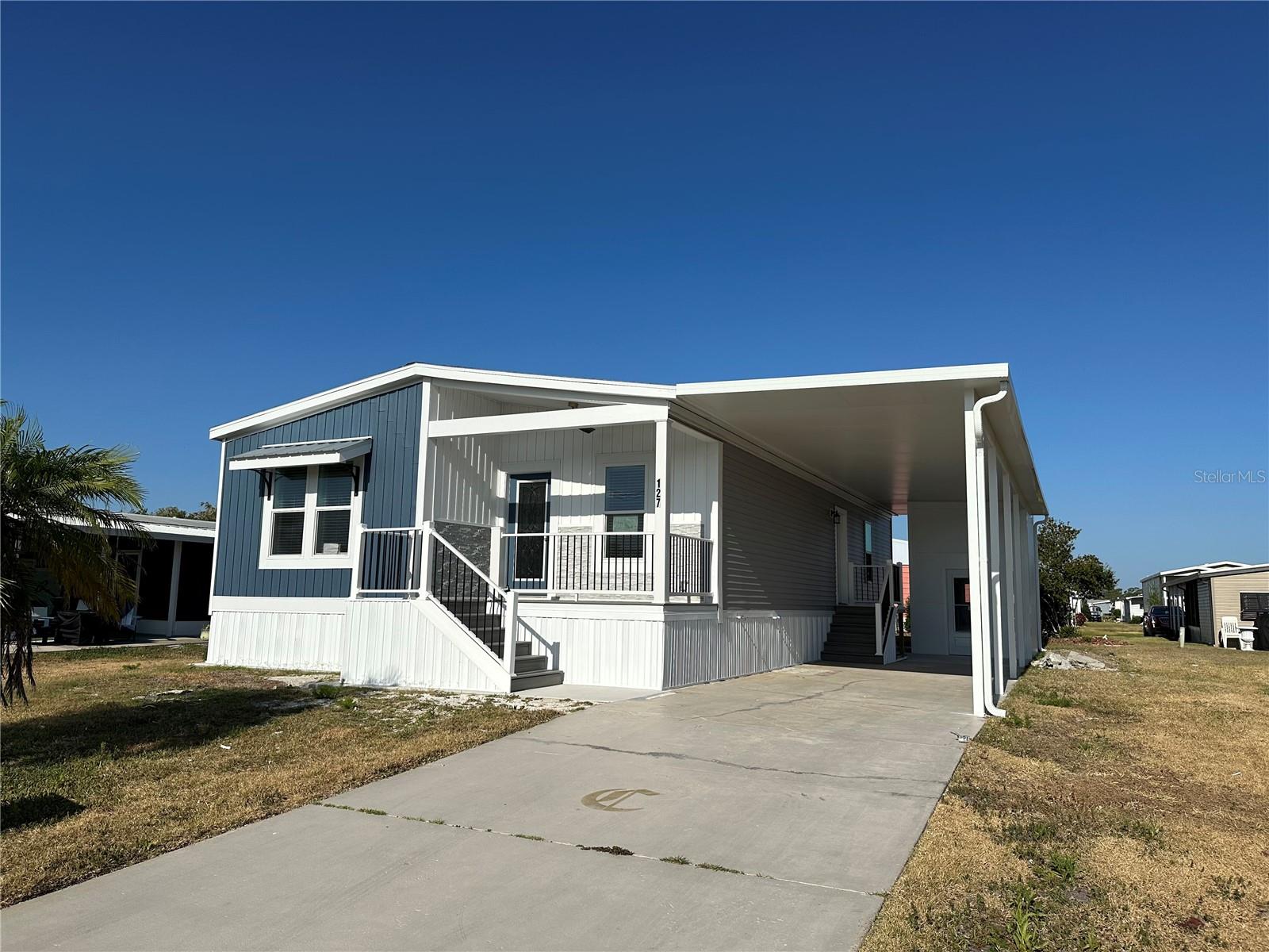Brand New! Presenting a fantastic opportunity to own a brand-new double wide manufactured home with exceptional features. This spacious residence boasts 2 bedrooms, 2 baths, a bonus office or den, and a delightful covered front porch. Step inside this modern home and discover a world of comfort and style. Each room is equipped with ceiling fans, ensuring a cool and pleasant atmosphere year-round. The open layout seamlessly connects the living spaces, creating a welcoming and inclusive environment for you and your loved ones. The kitchen is a culinary enthusiast's dream, featuring sleek stainless steel appliances that effortlessly blend form and function. The convenient island offers additional countertop space, making meal preparation and entertaining a breeze. Whether you're hosting a dinner party or enjoying a casual family meal, this kitchen is sure to impress. Retreat to the private bedrooms, where relaxation and tranquility await. The master suite provides a peaceful oasis, complete with an attached bathroom and ample closet space. The second bedroom is perfect for guests or as a cozy retreat for family members. Additionally, the bonus office or den provides a versatile space that can be tailored to your specific needs, whether it be a home office, library, or hobby room. One of the highlights of this home is the inviting covered front porch, ideal for enjoying a morning cup of coffee or unwinding after a long day. This outdoor space offers a peaceful setting to soak up the Florida sunshine or gather with friends and neighbors. As a resident of Harbor Isles, you'll have access to a range of community amenities, including a clubhouse, swimming pool, fitness center, and more. Enjoy the Florida lifestyle to the fullest with this remarkable manufactured home in a highly sought-after location. Don't miss out on this incredible opportunity to own a double wide manufactured home with 2 bedrooms, 2 baths, a bonus office or den, and a charming covered front porch in the desirable community of Harbor Isles. Contact us today to learn more and make this dream home a reality!