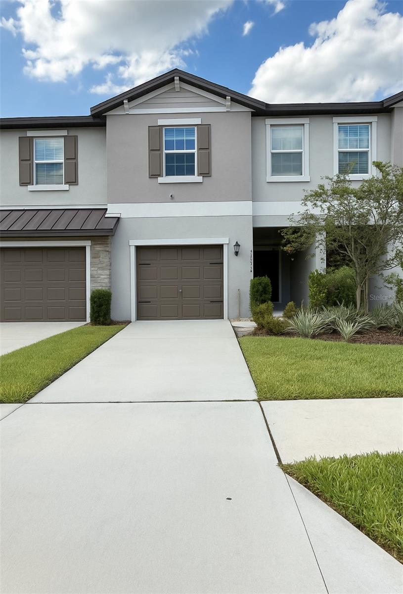 Step into effortless Florida living in this beautifully designed home where airy, open-concept spaces create a warm and inviting atmosphere. The first floor boasts a spacious living room, modern kitchen, and dining area that flow seamlessly together—perfect for entertaining or everyday living. Sliding doors open to a covered patio, offering a peaceful retreat for morning coffee or evening relaxation.
Upstairs, a versatile central loft provides flexible space ideal for a home office, play area, or media room. Two generously sized secondary bedrooms offer comfort for family or guests, while the privately located owner’s suite serves as a true sanctuary. Enjoy a full-sized en-suite bathroom and an expansive walk-in closet in this tranquil corner retreat.