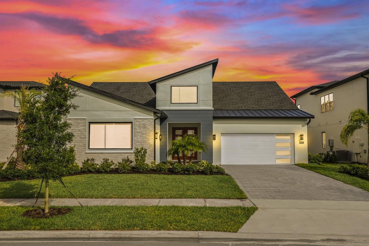 Welcome to the Bordeaux Modern, a striking contemporary one-story residence located in the private community of Laurel Pointe, Toll Brother’s new and gated neighborhood with only 124 homes. Completely sold out with construction complete, this home represents a rare opportunity to own in one of Lake Nona’s most sought-after communities.
This thoughtfully designed four bedroom, four bathroom home spans nearly 3,000 square feet of luxury living space on a generous .23-acre lot. The bold modern elevation and clean architectural lines make a stunning first impression. Inside, soaring ceilings, sleek tile floors, and an open-concept design create a perfect balance of style and comfort.
The heart of the home features a chef’s kitchen with an oversized waterfall island, walk-in pantry, custom cabinetry, and premium appliances, flowing seamlessly into the casual dining space and expansive great room with a dramatic feature wall. Walls of glass frame the private conservation view and open to the covered lanai, offering the ideal setting for indoor-outdoor entertaining. The oversized backyard provides plenty of room to design your own pool and backyard oasis.
The primary suite is a serene retreat with tray ceilings, large windows overlooking the conservation, a spa-inspired bathroom with dual vanities, a free-standing tub, an oversized shower with designer tile, and a spacious walk-in closet. Three additional bedrooms each include walk-in closets and access to full baths, while a versatile flex room provides the perfect space for a home office, media lounge, or playroom.
Additional highlights include a split three car garage, and energy-efficient construction with designer finishes throughout. As a Laurel Pointe homeowner, you will also enjoy full access to Laureate Park’s amenities, including LP Fit fitness center, resort-style pools, playgrounds, and miles of trails. Lake Nona’s Town Center, Medical City, and top-rated schools are just minutes away.