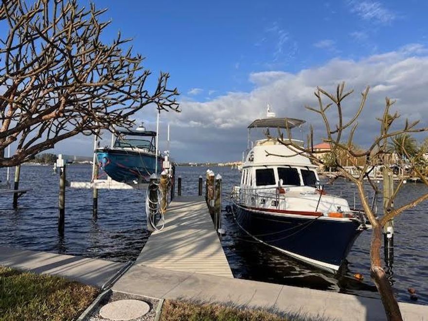 A beautiful waterfront lot in Madeira Beach that offers a unique opportunity to create your custom coastal retreat. Measuring 110 feet by 59 feet, the lot is fully cleared and ready to build—no demolition, an empty canvas for painting your dream. It sits on deep water with over six feet of depth all the way to the intracoastal, offering direct access to the Intracoastal Waterway and just minutes from the wide-open waters of the Gulf via nearby John’s Pass.

Boaters will appreciate the new marine infrastructure completed in 2023, including a 50-foot dock with durable eight-foot-wide artificial decking. The dock is equipped with both 50-amp and 30-amp power service, ready to accommodate larger vessels. A 20,000-pound boat lift stands ready for your center console or sportfish, and tide slides allow for secure mooring of yachts up to 50 feet. Every element—from the dock and pilings to the lift and electric—was built new in 2023 with quality and longevity in mind.

From the lot, you’ll enjoy wide-open views of Boca Ciega Bay, where the sun rises over calm water and dolphins pass by with the tide. The Madeira Beach Marina is less than 500 yards away, making it easy to fuel, bait, and stock up on your way to heading out for a day on the water. Whether you're a weekend angler, a serious yachtsman, or simply looking to enjoy life by the sea, this lot offers the ideal foundation.

It's more than a piece of land—it's a rare slice of Florida waterfront, ready for whatever dream you choose to build.