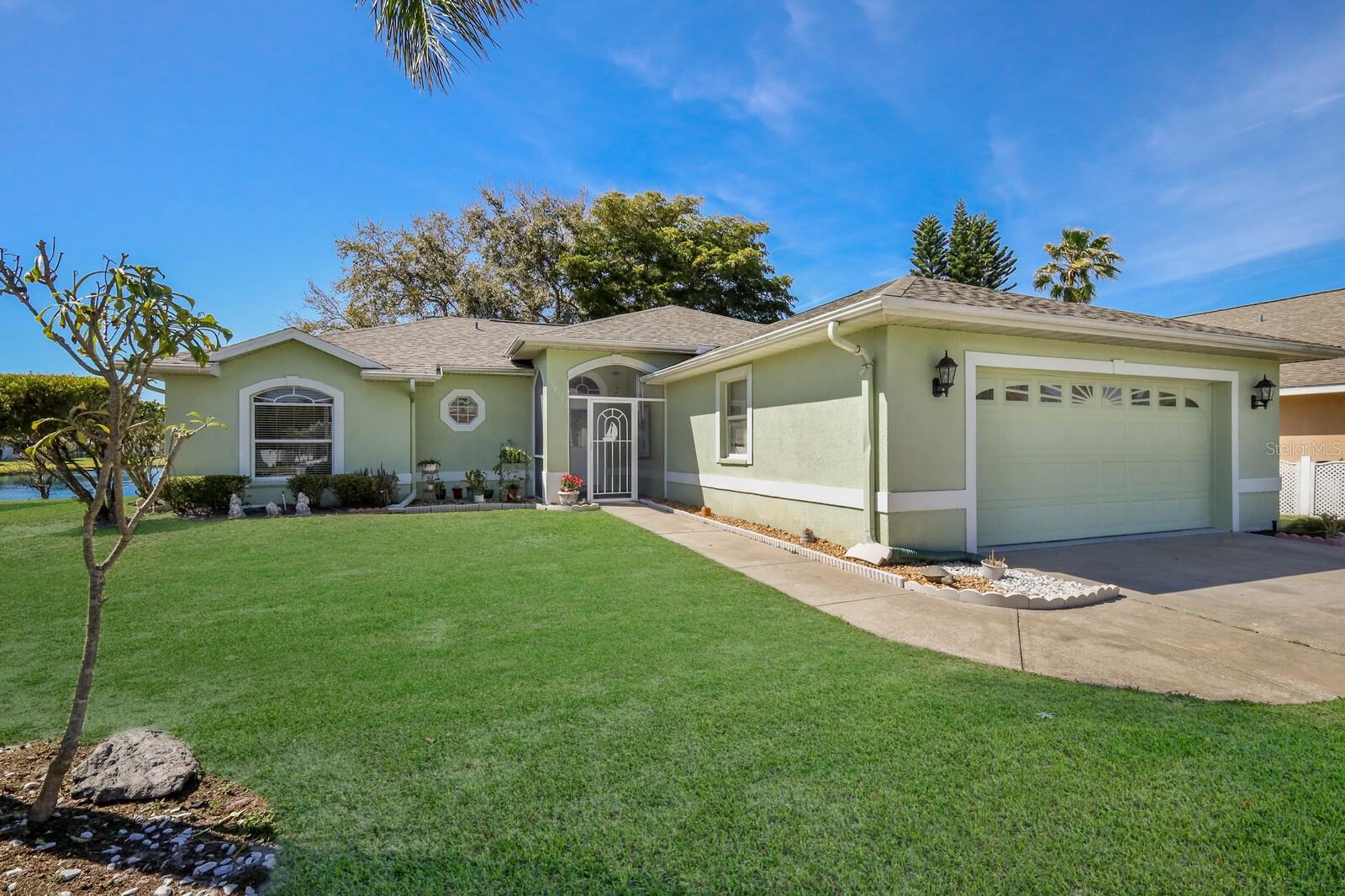 This 3-bedroom, 2-bath residence boasts stunning water views from every corner, including the kitchen, great room, primary bedroom, and secondary bedrooms. Enjoy direct access to a sunroom overlooking the pond from the primary bedroom's sliding door, complemented by a spacious walk-in closet. With a split design floorplan, two additional bedrooms and a bath are conveniently situated on the opposite side of the house. Located in a charming community close to shopping, dining, and major highways, this home offers both comfort and convenience.