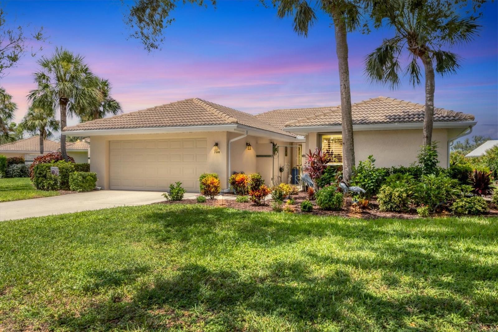 Waterfront, Free-Standing Golf Villa – Privacy, Views & Resort-Style Living! Experience Florida living at its finest in this beautifully maintained, no-storm-damage, flood-insurance-free villa, peaceful, private and perfectly tucked inside the gated Saint George community at the sought-after Plantation Golf & Country Club. From the moment you step onto your private front porch, sparkling waterfront views welcome you home and it only gets better from there. The oversized, professionally landscaped lot offers mature trees, vibrant blooms, and a warm, inviting entry. Inside, the open great room layout is highlighted by: Many newer features including: appliances, electrical panel, repiped with PVC, water heater, HVAC with maintenance records, ductwork, washer/dryer. Hurricane-impact bay windows with electric blinds in the den, Granite kitchen countertops and a cozy eat-in breakfast nook. Tile roof, carpet in one bedroom only, security system installed, entertainment-ready wet bar with wine & beverage storage, Upgraded Oversized Master Bath with double vanity, pet-friendly and move-in ready, Step onto your completely replaced screened lanai—a rare end-unit design with no shared walls, offering unmatched privacy. Enjoy peaceful water views, graceful ducks, and front-row seats to watch ospreys dive for their catch. Every sunset here is a private show, right from your lanai. Additional outdoor upgrades include leaf guards and landscape lighting for effortless upkeep. Conveniently located near beaches, shopping and dining. Saint George residents enjoy a private pool & clubhouse with seasonal gatherings, and optional memberships at Plantation Golf & Country Club provide access to golf, tennis, pickleball, bocce, fitness, dining, and an active social calendar. Ideal for a primary residence or Snowbirding at its finest. Some furnishings available if desired.