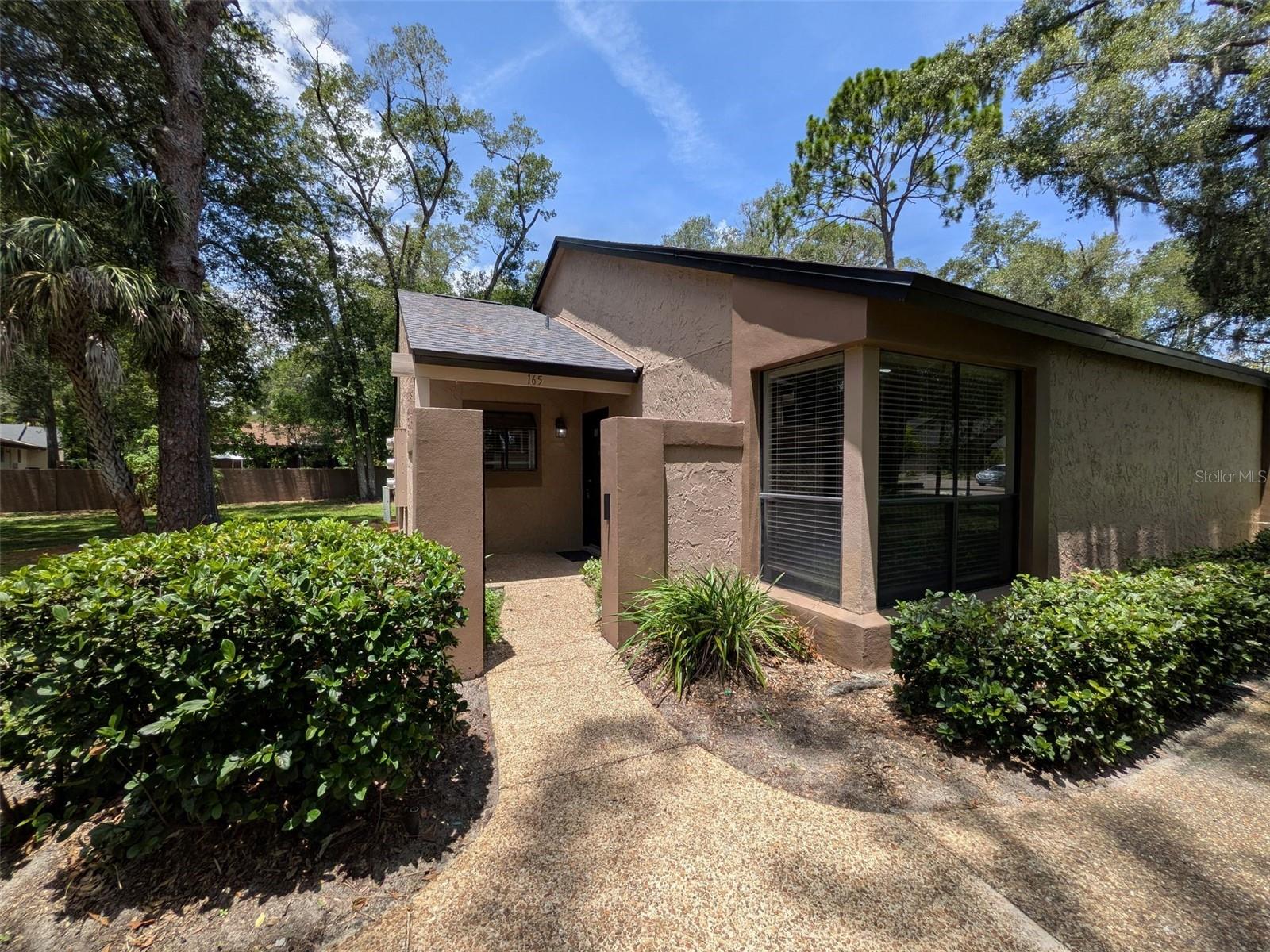 Welcome to your own cozy, comfy & spacious home. This END unit in the serene well -maintained enclave of Village Townhome Condominiums is ready for new owners. Ideal for first home buyers or downsizers!! If you like nature, trees, quiet, this is your community, yet close to all major roads, shopping, amenities, parks, Wekiva & trails, medical facilities, restaurants and more. This well maintained 1/1 unit is move in ready features, wood burning fireplace, fresh paint, new carpet, updated appliances, light fixtures, screened back porch with storage, front patio, Enjoy the peace & quiet of the community. Easy show!!