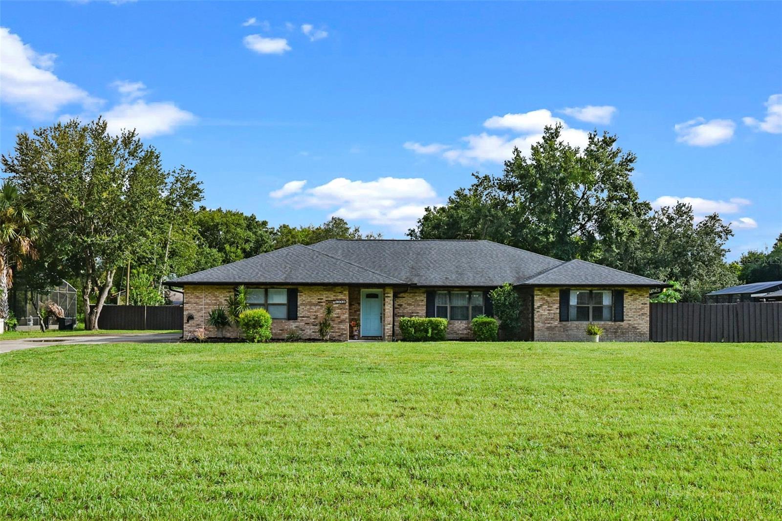 Welcome to the highly sought-after estate area of Deltona. This beautifully updated 3 bedroom, 2 bathroom, fully fenced pool home is nestled on 0.71 acres with no HOA, offering both privacy and space to enjoy. Inside, the split floor plan with vaulted ceilings creates an open, airy feel while luxury vinyl flooring (2022) flows seamlessly throughout. The updated kitchen boasts quartz countertops, stainless steel appliances, and plenty of room to entertain. Fresh interior paint (2025), an interior laundry room, and a spacious 2-car garage add to the home’s functionality. Major updates include a new drain field (2018), septic pumped in June 2025, AC (2018), and newer roof and gutters (2020). Step outside to your own private retreat. The heated saltwater pool and jetted spa (2020-2021) with elegant brick paver surround are perfect for relaxing or entertaining, all within a screened enclosure. Enjoy evenings under the oversized covered lanai or take advantage of the 25x25 detached metal storage shed/workshop (2021) on a concrete slab, built to withstand hurricane-force winds and large enough to store vehicles. A chicken coop and expansive fenced yard complete this versatile property. Beyond the home, Deltona continues to grow with exciting plans for a vibrant future downtown area, featuring restaurants, shops, and a walkable community hub—all while maintaining the charm and natural beauty that make this location so desirable.