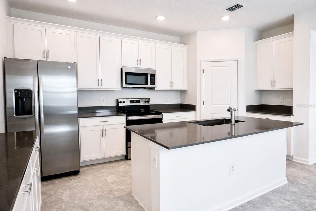 Photo of 136 Aces High Lane, Davenport, FL 33896 (MLS # O6386000)