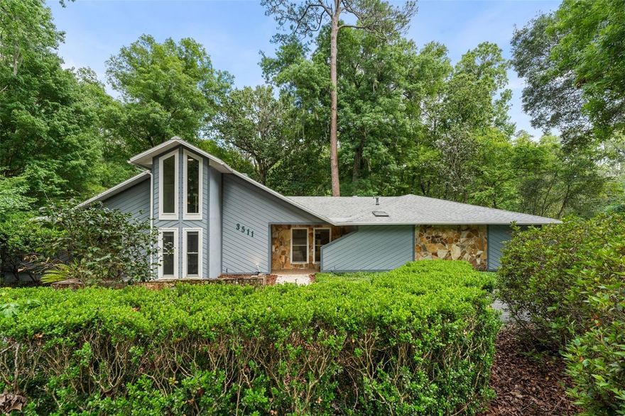 Stunningly renovated 4-bedroom, 2-bathroom home featuring a modern open floor plan, premium upgrades, and an unbeatable location in Northwest Gainesville! Situated in the highly established and widely recognized Rock Creek neighborhood—one of the area's most desirable suburban enclaves tucked away just off NW 34th Street—this property offers an exceptional lifestyle supported by an impressive lineup of private recreational facilities. From the moment you arrive via the convenient circular drive, you are greeted by beautiful landscaping and a neighborhood thoughtfully mapped out with wide, tree-lined sidewalks under a mature overhead canopy, promoting an active, walkable environment. Step inside to a light-filled living space showcasing the diverse, charming architectural features the neighborhood is known for, boasting a dramatic cathedral ceiling, skylight, and a magnificent large stone fireplace that serves as the heart of the family room. The gourmet new kitchen is a chef’s dream, beautifully appointed with new stainless steel appliances, premium quartz countertops, white shaker soft-close wood cabinets and a functional kitchen island that works as a convenient breakfast bar. Escape to the private primary suite featuring a generous walk-in closet and a sought-after split bedroom floor plan for maximum privacy. A unique spiral staircase leads to a spacious loft overlooking the family room—ideal for a home office, media room, or flex space. Enjoy seamless indoor-outdoor living with double sliding glass doors that open up to a massive large back deck, making the vibrant outdoor space an extension of your home and providing the ultimate backyard oasis for entertaining or unwinding at the end of the day. The property captures the neighborhood's unique natural setting, situated where Possum Creek and Three Lakes Creek converge to create a picturesque rolling topography filled with dense oak hammocks and towering pines, giving the entire area the distinct feeling of a remote woodland retreat right in the heart of the city. For maximum efficiency and comfort, the home is equipped with 2 AC units, 2 gas hot water heaters, a whole yard irrigation system to keep your lawn pristine, and a durable roof from 2013. Beyond the home itself, residents enjoy exclusive access to robust community amenities including a keyless-entry community swimming pool, dedicated tennis and pickleball courts, an enclosed racquetball court, a standard basketball court, and a central children's playground—all without the restrictive feel or heavy costs of a standard corporate development. This premier geographic location places you just minutes from Gainesville’s primary employment, medical, and cultural hubs, offering hassle-free access to the University of Florida campus and stadium, Santa Fe College, UF Health Shands Hospital, HCA Florida Gainesville Hospital, downtown Gainesville, and nearby Thornbrooke Shopping Village. Additionally, families prioritizing education will love that this home is zoned for some of Alachua County's most consistently top-rated public schools, including Littlewood Elementary, Westwood Middle, and F.W. Buchholz High School, a perennially rated "A" institution nationally recognized for its rigorous academic achievements. Don't miss this move-in-ready masterpiece that perfectly combines space, natural serenity, and top-tier community amenities—schedule your private tour today!