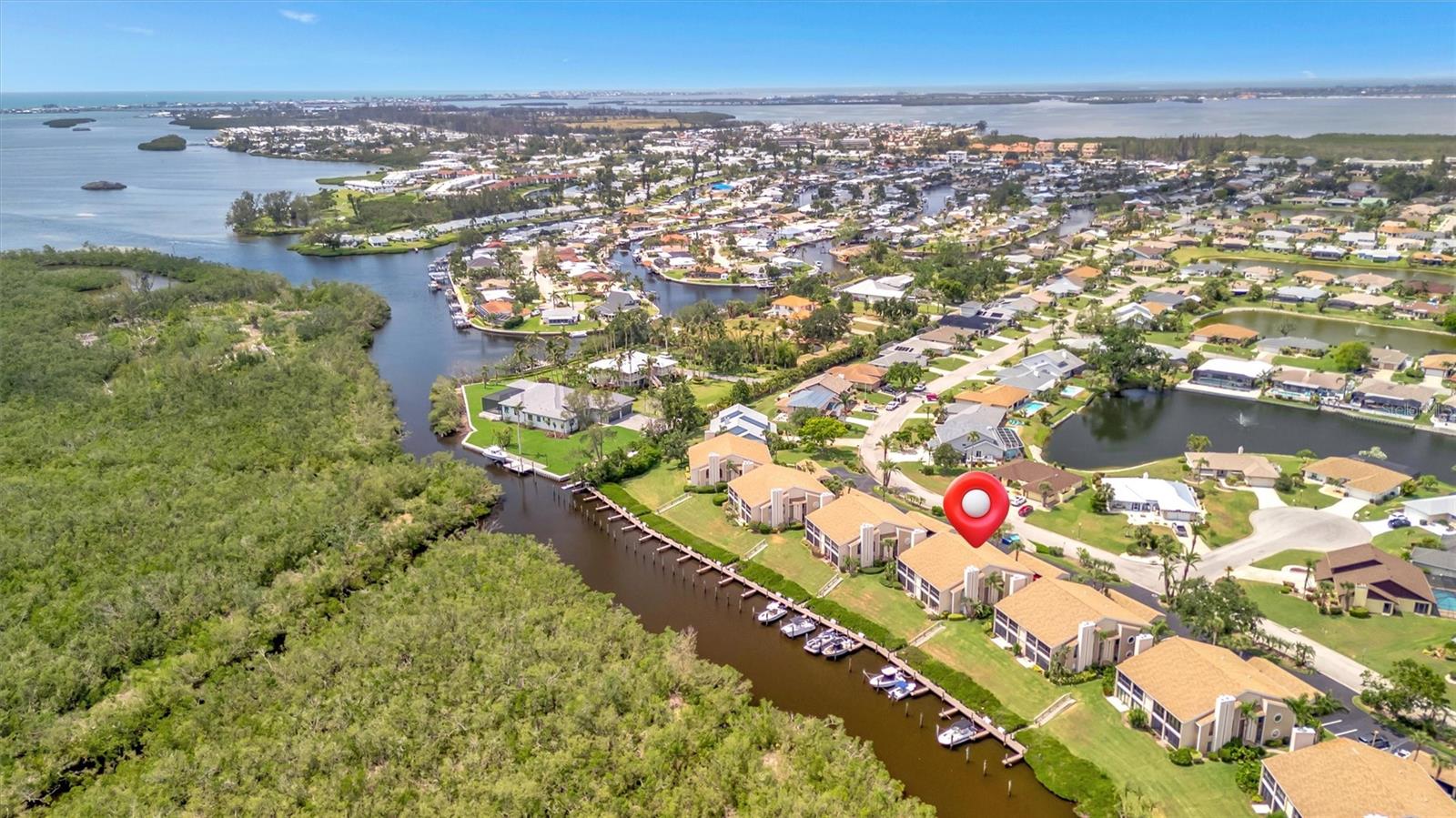 BOATER'S PARADISE!! Welcome to Bay Hollow – a rare opportunity to own a beautifully maintained second-floor condo offering stunning water views, a private boat dock, and community pool.
This spacious 2-bedroom, 2-bath residence spans 1,561 sq ft of thoughtfully designed living space. Step inside to find an inviting open-concept layout with an abundance of natural light, highlighted by a cozy living room fireplace – perfect for relaxing evenings with family or guests.
Enjoy serene waterfront views from your private balcony, ideal for morning coffee or sunset cocktails. Boating enthusiasts will love the convenience of a deeded private dock, providing direct access to the Intracoastal Waterway and beyond.
The primary suite features a walk-in closet and en-suite bath, while the guest bedroom and second full bath offer comfort and privacy for visitors. The condo also includes in-unit laundry, ample storage, and covered parking.
As part of a well-maintained community, you’ll have access to a sparkling pool, lush landscaping, and a peaceful, laid-back coastal lifestyle – all just minutes from the beaches of Anna Maria Island, historic Cortez fishing village, world-renowned IMG Academy, shopping, dining, and local golf courses.
Whether you’re looking for a full-time residence, seasonal escape, or investment property, this waterfront gem checks every box.
Don’t miss your chance to own a slice of paradise – schedule your private showing today!