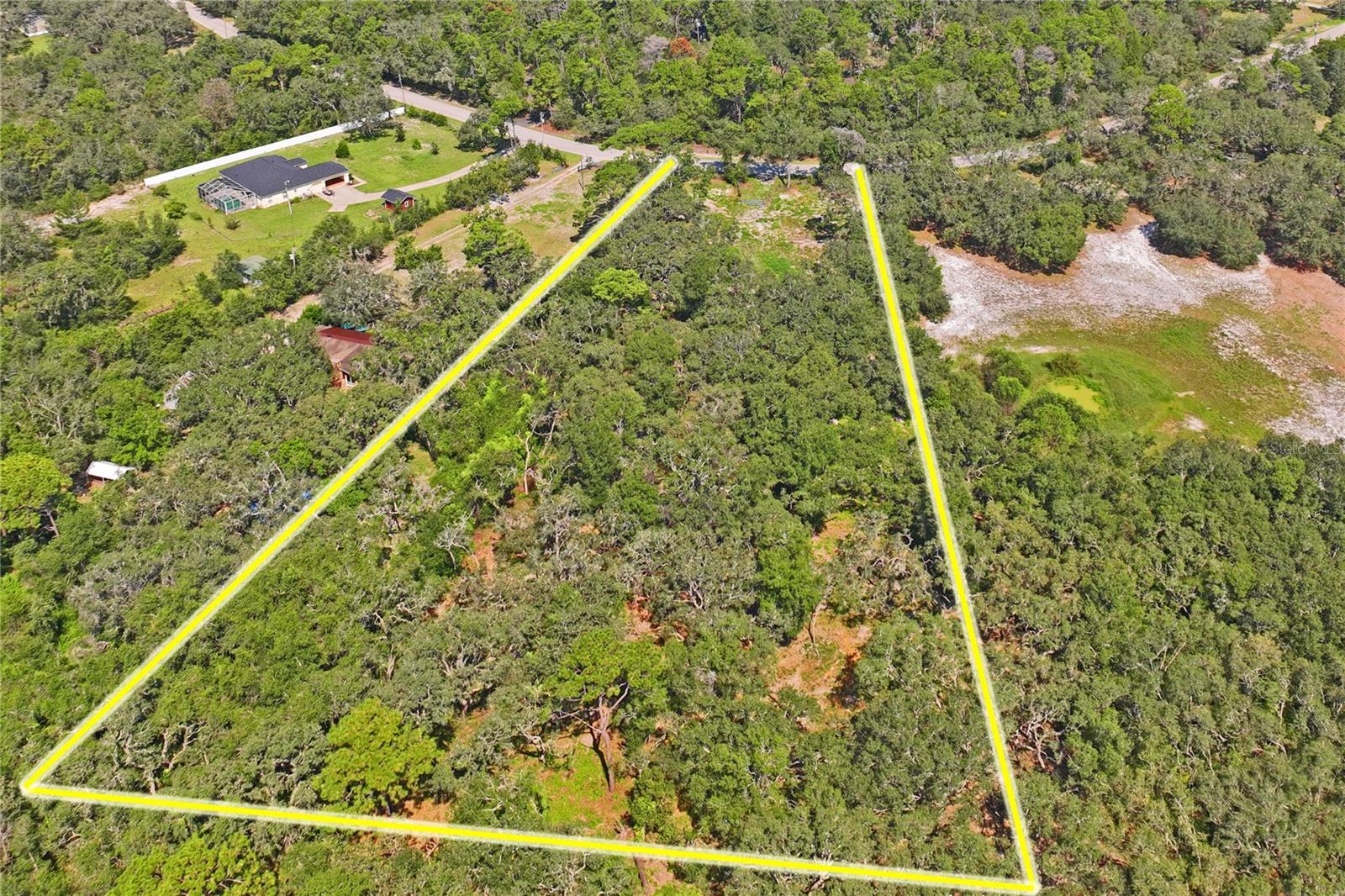 Welcome to your private oasis on 4.25 acres of partially cleared land, primed for your dream home! This beautiful parcel is centrally located between County Line Road and SR 52, in a rapidly growing area. The property is just 5 minutes from essential amenities such as Public, Starbucks, gas stations, medical facilities, restaurants, and shops. Enjoy outdoor recreation with parks and the Gulf for fishing and fun, only 15 minutes away. Plus, you're only 30 minutes from Tampa International Airport.
Once your home is built, the property offers ample space for an RV, horses, and boats, making it ideal for your forever home. Be sure to check with Pasco County for approved sizes of guest homes, barns, garages, or any additional outbuildings you have in mind.
All information is believed to be accurate but should be verified by the buyer or buyer's agent.