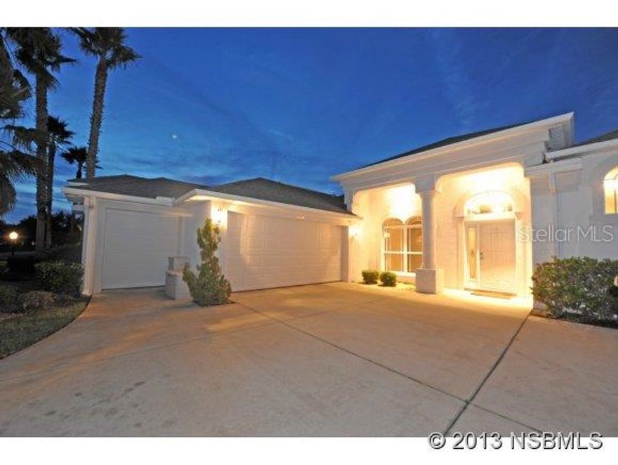 Located in Spruce Creek Fly-In, this hardly lived-in pool home has been freshly painted inside/out and has new carpets and newer appliances. Shows like new. Upgraded Renaissance Model by renown builder Paytas. Roomy 3-Bedrooms, 2-baths home built on a unique waterfront lot. Extensive professional landscaping with tropical foliage and palm trees greet the visitor. Inside, this solid concrete block home features an open design with ceramic tile floors, a neutral decor and plenty of privacy for entertaining. Screened Lanai with plenty of space for outside dining features a custom pool with dramatic lighting and waterfalls. The Lanai offers expansive views of a beautiful lake. Great room with views of the pool area through glass sliding doors offers architectural details, built-ins and tray ceilings. The open kitchen with separate breakfast room and bar also offers views of the pool through seamless corner windows. Master suite with large walk-in closet and sliding glass doors to the Lanai. The Master bath features dual vanities and separate tub and shower areas. Two large bedrooms share the other bath. Ample closet space throughout. Three-stall garage includes golf cart space and attic storage space. Inside laundry room with washer and dryer. Sprinkler System with private deep well. Spruce Creek Fly-in is the world's most famous Residential Airpark. 4,000 lighted runway, GPS approach Golf Course, Club, 24-hr patrolled security. ;Water: City