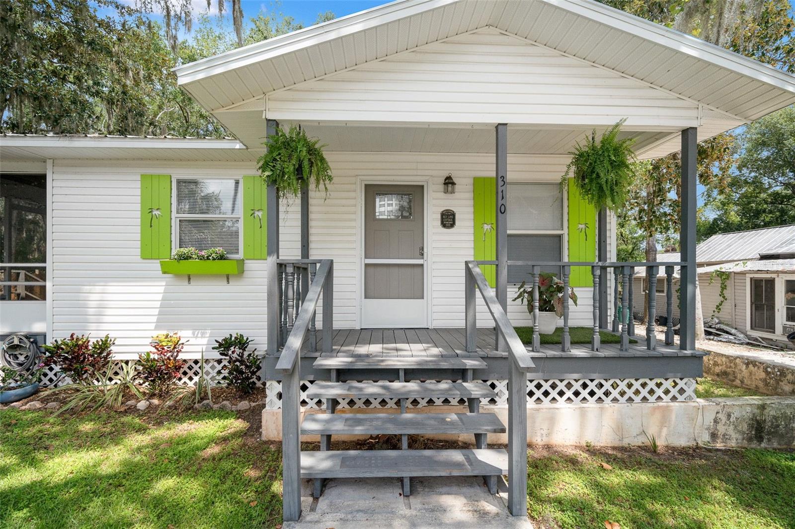 One or more photo(s) has been virtually staged. Welcome home to the "Key Lime Cottage" in historic downtown Inverness! This beautifully maintained two-bedroom, one-bath Key West-style cottage offers a delightful blend of coastal charm and small-town living. Enjoy lazy mornings on the shaded front porch, located minutes from historic downtown, bustling with inviting cafés, unique shops, and the Depot District's Saturday morning market, as well as scenic parks and trails. This move-in ready home features heart of red pine construction and a lifetime metal roof. It also boasts a modern upgraded kitchen with newer appliances in an oversized space, an energy-efficient Lennox HVAC system currently under warranty, a new water heater, and stylish vinyl plank flooring. Outdoor enthusiasts will appreciate the opportunity to cycle the 46-mile Withlacoochee State Trail that runs through Inverness, explore Fort Cooper State Park, or enjoy Henderson Lake within the Tsala Apopka Chain of Lakes. The area’s proximity to natural springs, including Three Sisters Springs—where manatees gather in winter—makes this spot truly unique. In 2025, Inverness was recognized for its charm by finishing 3rd in USA Today’s Best Small Towns with populations under 25,000. This is more than a home—it’s a lifestyle. Don’t miss your chance to live island-style in the heart of Florida's small-town treasure.
Close