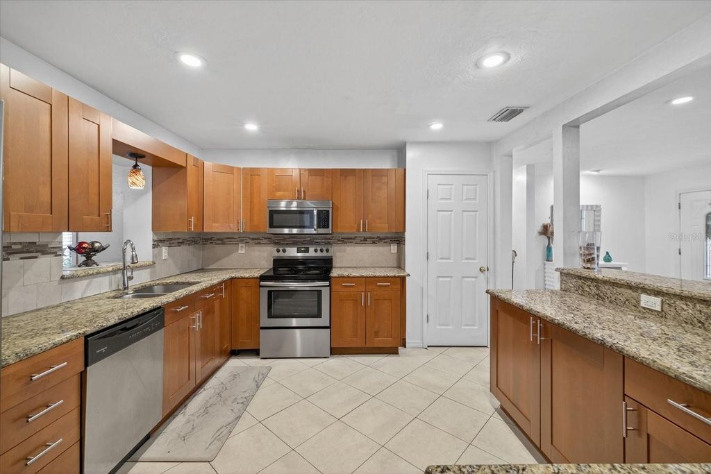 Photo of 420 Lewis Boulevard SE, St Petersburg, FL 33705 (MLS # TB8419501)