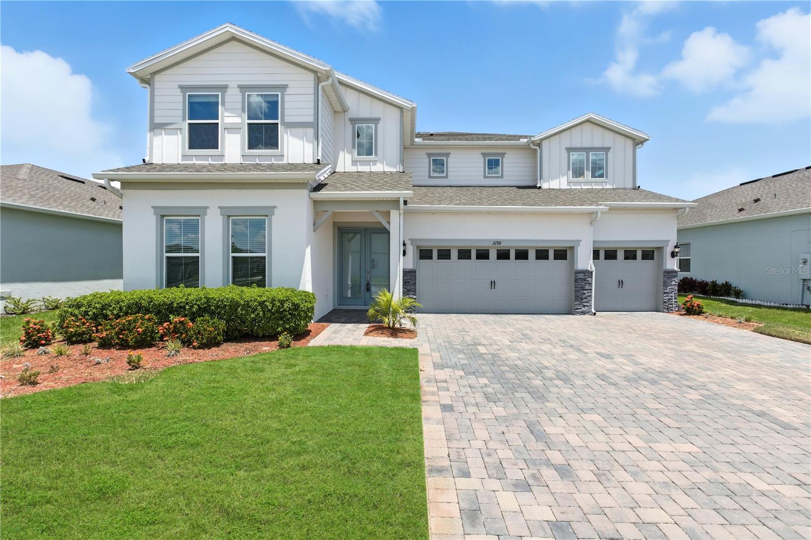Located in the highly sought-after GATED COMMUNITY of Estates at Lakeview Preserve, this stunning 2023-built home showcases extensive HIGH-END UPGRADES and a SPACIOUS LAYOUT that perfectly blends luxury, comfort, and privacy within one of Winter Garden’s most desirable neighborhoods. Beautifully designed, this 5-bedroom, 5-bathroom residence features one of the largest floor plans in the community.
The main level includes wood-look tile flooring, a bright flex room perfect for an OFFICE or DEN, and a PRIVATE GUEST SUITE with a beautifully appointed ensuite bathroom. There is also a main-level bathroom ideally positioned with access to the backyard, offering flexibility for a future pool. The gourmet kitchen is fully built-in, with QUARTZ countertops, a large island, WALK-IN PANTRY, and a BUTLER'S AREA with wine fridge, all open to the living and dining spaces.
Upstairs, the OWNER'S SUITE is a true sanctuary, with plenty of space for large furniture, a sitting area, and TWO WALK-IN CLOSETS. The spa-inspired owner’s bathroom is complete with TWO VANITIES with quartz countertops, a soaking TUB, and a step-in shower with beautiful tile. The additional bedrooms feature a Jack-and-Jill layout and a another private guest suite. The laundry area is located upstairs for added convenience.
Additional highlights include a 3-car garage with EPOXY FLOORS, a covered lanai, and a LARGE backyard, ready to customize.
Living in The Estates at Lakeview Preserve means being surrounded by nature and elevated comforts, with two private gated entrances and exclusive access to a resort-style pool, a modern fitness center, clubhouse, playground, and scenic trails that invite peaceful walks by the lake.
Just 6 miles from SR-429, and close to Disney, Winter Garden Village, and top-rated schools, this exceptional residence offers a lifestyle of luxury, comfort, and community.