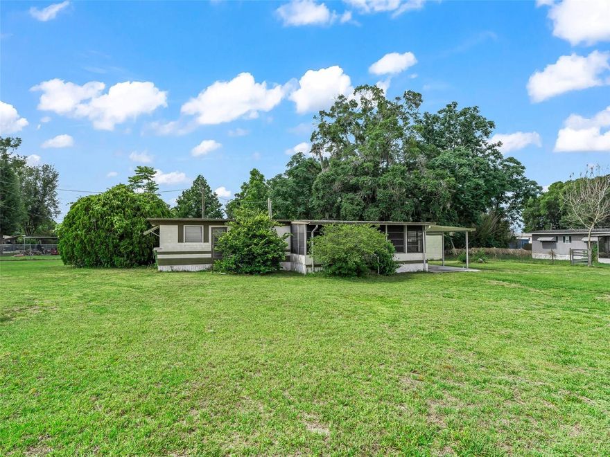 Discover this cozy 1-bedroom, 1-bath mobile home nestled on nearly half an acre (0.48 acres) in the Moreland Park subdivision. Built in 1959, this home boasts classic charm and solid construction, featuring beautiful wood flooring that adds warmth and character throughout. The 400 sq ft layout includes a bright, open living room and a functional kitchen, making it an ideal space for relaxing or entertaining. Two storage sheds in the backyard provide ample room for your tools, toys, or seasonal items. Whether you’re looking for a weekend retreat, a starter home, or an investment property, this home offers flexibility and potential. Enjoy the convenience of being just five minutes from Downtown Wildwood, and right around the corner of the newly developed Twisted Oaks Subdivision. Highway US 301 is down the road and access to major highways such as the Florida Turnpike is 10 minutes South. All appliances and storage are conveyed with the property, making this move-in-ready opportunity even more appealing. Don’t miss your chance to own a charming piece of Moreland Park with endless possibilities!