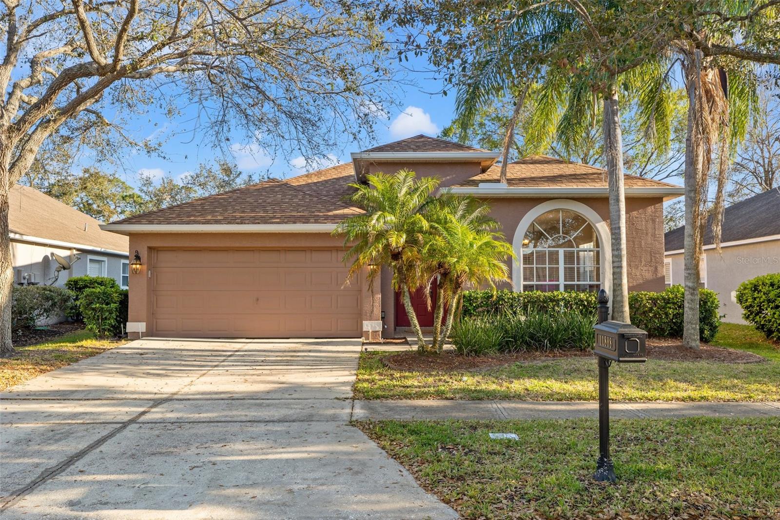 This beautifully maintained 4-bedroom, 2.5-bathroom home is located in the highly sought-after Westchase community. Featuring
hardwood floors, a versatile living/dining room combo, and a spacious kitchen with stainless steel appliances, gas range, and eat-in
space overlooking the open family room, this home is ideal for everyday living and entertaining. Step out into the extended enclosed
lanai and fully fenced backyard for year-round enjoyment. The privately situated owner’s suite is a true retreat with a beautifully
updated en-suite bathroom, dual sinks, touch-activated mirrors, a walk-in shower with built-in niches and a bench, and a walk-in
closet. A split floor plan adds privacy with three additional bedrooms and two bathrooms. High ceilings, a 2-car garage, and thoughtful
design throughout complete the package. Enjoy Westchase’s resort-style amenities including pools, tennis and pickleball courts,
playgrounds, and a golf course—all just 15 minutes from the airport, beaches, downtown Tampa, and top-rated schools. Live the
Florida lifestyle in an exceptional community!