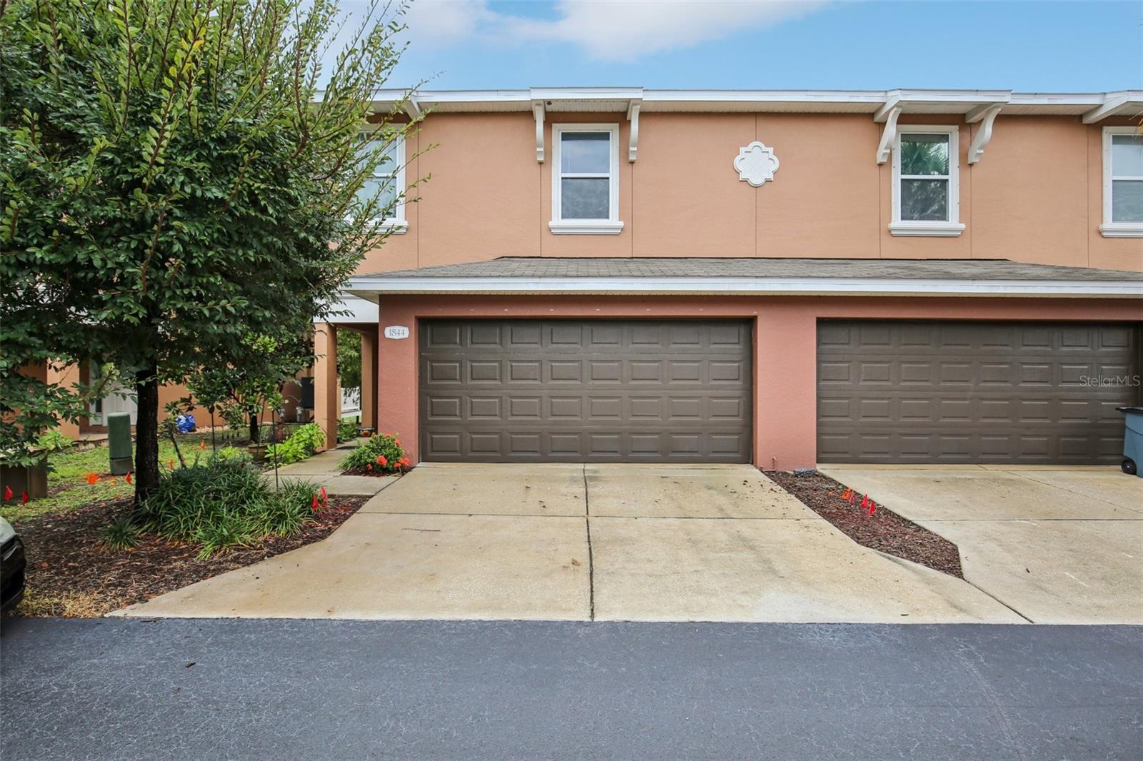 Welcome Home to the newer construction Townhouse you have always dreamed of! Built in 2015 to meet stringent Florida Hurricane Building Codes, this stunning 3-bedroom, 2.5-bathroom, 2-car garage end unit townhome offers 1,604 sq. ft. of modern living. Every door and window is equipped with HURRICANE-RATED protection, and its Flood Zone X designation means NO FLOOD INSURANCE REQUIRED. The rare Island Kitchen floor plan is a Chef's Dream with granite countertops, stainless steel appliances, glass backsplash, walk-in pantry, and elegant wood cabinetry. Relax on the brand-new composite plank rear deck overlooking a serene conservation area and trail, with no rear neighbors and the community pool just steps away. Conveniently located, you’ll be just minutes from the Pinellas Beaches and the historic Sponge Docks, where authentic Greek cuisine, waterfront shops, boat tours, and annual festivals bring Tarpon Springs’ Mediterranean spirit to life. Outdoor lovers will enjoy easy access to the Pinellas Trail - ideal for walking, jogging, or cycling along the Gulf Coast. Meticulously maintained, this home includes a transferable pest control contract (valid through April 2026) and an American Home Shield home warranty (valid through July 14, 2026). Additional highlights include new gutters, engineered wood plank flooring on the main level (except the bathroom), and a washer/dryer conveniently located upstairs near the bedrooms. This pet-friendly community is zoned for the top rated schools of Tarpon Springs Elementary, Middle, and High Schools, plus the nearby St. Petersburg College campus offers the St. Petersburg Collegiate Program for High School students wanting to complete college credits prior to graduating. This beautiful Townhome won't last long. Make your private showing appointment today!