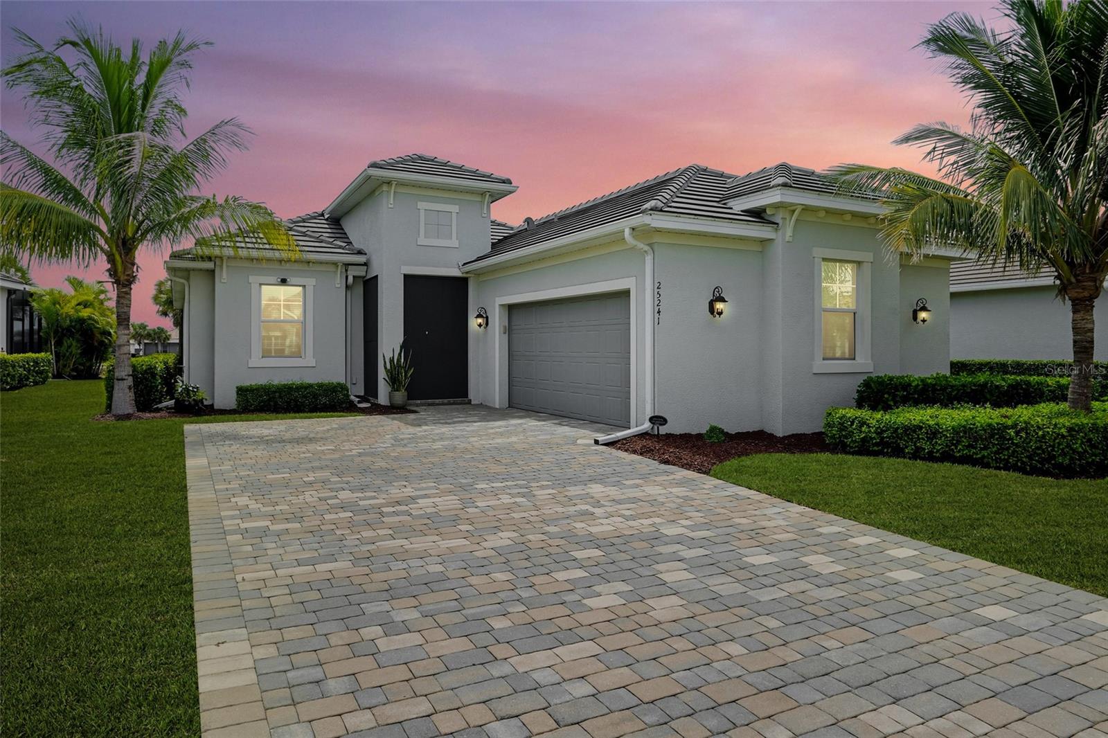 Enjoy Incredible Views and Resort Living in Heritage Landing. Discover your own private oasis with a deeded golf membership & breathtaking views of both the golf course & sparkling lake. This elegant home is designed for the ultimate Florida lifestyle, featuring a private pool, outdoor kitchen, and expansive lanai that makes every day feel like a resort escape. Step inside to an open floor plan that flows seamlessly from the kitchen and living room to the outdoor living space. High tray ceilings, crown molding, and plank tile flooring create an atmosphere of refined elegance. The gourmet kitchen is a chef’s dream with stainless steel appliances, wall microwave/oven combo, cooktop, large island with granite countertops, under-cabinet lighting, and a spacious pantry. The living room’s triple sliding patio doors extend the living space outdoors to the covered lanai—perfect for alfresco dining and entertaining. Retreat to the luxurious primary suite with private lanai access, walk-in closets, and a spa-inspired bathroom featuring split vanities, granite countertops, a garden tub, walk-in shower, and private water closet. The split floor plan offers privacy with a second bedroom and full bath, while the versatile den with French doors can serve as a home office or guest room. This home offers peace of mind with impact windows, Storm Smart Shutters, and a prime location in a non-flood zone. Built for safety and comfort, it’s the perfect blend of security and convenience—whether you’re a full-time resident or a seasonal homeowner. Beyond your doorstep, Heritage Landing offers a Gordon Lewis Championship golf course, pickleball, tennis, bocce ball, and a world-class fitness center. Relax at the resort-style pool or enjoy food and drinks at the Tiki Bar, or restaurant in the clubhouse. Conveniently located near downtown Punta Gorda, with easy access to both Punta Gorda and Fort Myers airports, this home combines luxury, leisure, and convenience. Don’t miss your chance to own this extraordinary home with unmatched views in Heritage Landing Golf & Country Club.