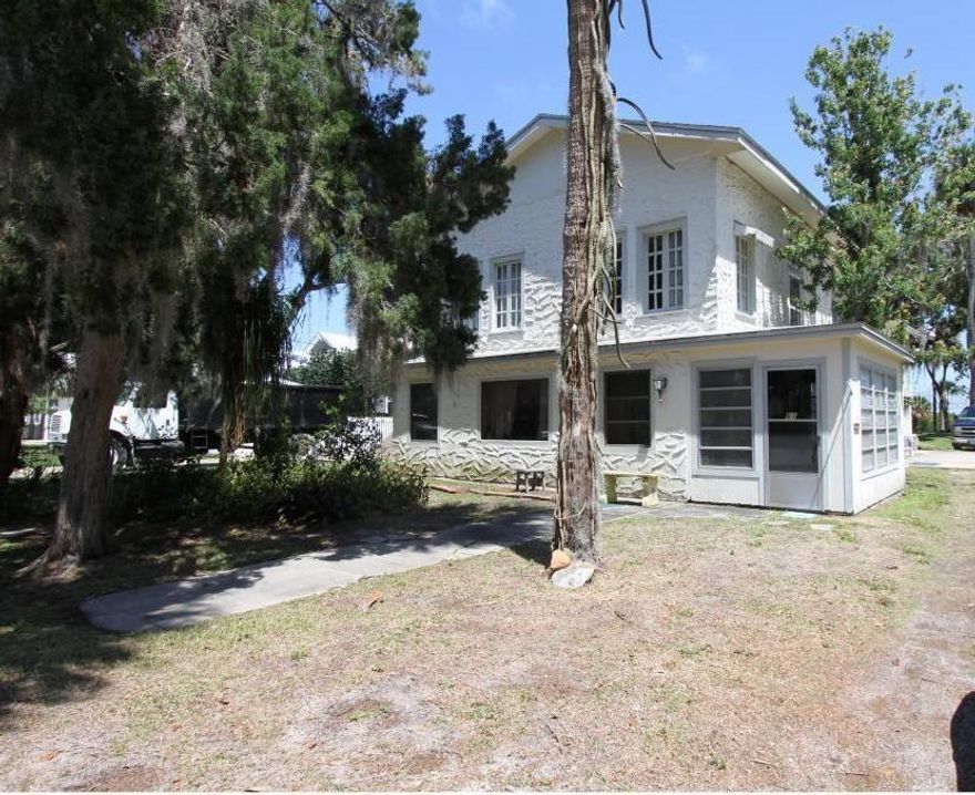 Riverside Drive lot with Riparian Rights stretches over 200 feet with endless views. Property stretches from Faulkner to Riverside Drive with a Faulkner Street address. City-owned land on waterfront East side of street, with dock permits typically granted. Existing home is a LARGE 3bed/2.5 bath, large flex room with balcony full of a lifetime of memories and treasures, however has no monetary value and needs to be razed.  Property is being sold as vacant land. No showings until acceptable offer. . Located in the heart of NSB and walking distance to both beachside Flagler AVe and Downtown Canal Street with an abundance of boutiques, shops, restaurants, fishing, biking, roller blading, paddle boarding and everything in between. Make this unique piece of old Florida charm lot/home your own NSBLIfestyles. Great place to raise your family; to live the lifestyles of NSB and create memories.; Cleared: Partial ;Water: Available at Site