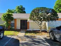 Cozy & cute 2/2 villa with tiled floors, updated kitchen & screen patio