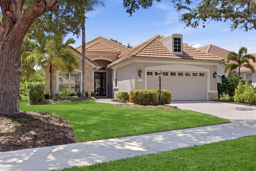 Nestled behind the gates of Lakewood Ranch Country Club, 7466 Edenmore Street offers the perfect blend of elegance, comfort, and maintenance-free living. This beautifully designed Neal Signature fully furnished home features 3 bedrooms, 2 baths, and an open-concept floor plan with soaring ceilings, abundant natural light, and timeless architectural details throughout. The spacious great room flows seamlessly into the gourmet kitchen, showcasing rich wood cabinetry, granite countertops, stainless steel appliances, and a generous breakfast bar ideal for entertaining. The spacious primary suite is a private retreat with tray ceilings, dual walk-in closets, a spa-inspired bath with separate vanities, soaking tub, and walk-in shower. Thoughtful upgrades including plantation shutters, updated lighting, fresh paint, crown molding, and ceramic wood-look flooring create a warm and invitng atmosphere. Sliding glass doors open to a covered lanai overlooking tranquil preserve and lake views, providing the perfect setting to relax and enjoy Florida’s indoor-outdoor lifestyle. Located in the highly sought-after Edenmore enclave, residents enjoy maintenance-free living with optional membership opportunities to the renowned Lakewood Ranch Country Club offering golf, tennis, fitness, dining, and social amenities. Conveniently located near UTC shopping and dining, top-rated schools, SRQ Airport, and the Gulf Coast’s award-winning beaches, this exceptional home delivers luxury living in one of Lakewood Ranch’s most desirable communities.