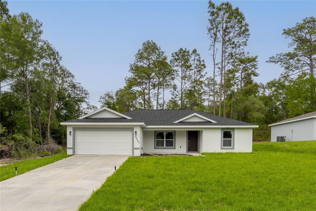 Photo of 9299 N Tahiti Way, Citrus Springs, FL 34433 (MLS # O6373216)