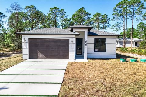 Photo of 322 Loire Ave S, Lehigh Acres, FL 33974 (MLS # A4689073)