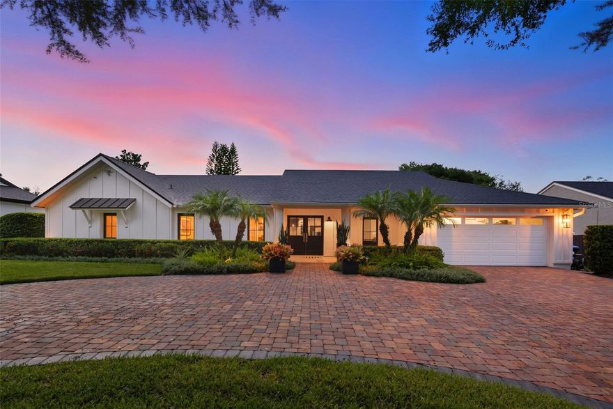 One or more photo(s) has been virtually staged. Welcome to your dream home in the heart of historic Dr. Phillips, inside the exclusive gated community of Orange Tree Country Club. This immaculate 4-bedroom, 2.5-bath residence blends farmhouse charm with modern luxury. Originally renovated in 2020 by Akers Custom Homes and thoughtfully updated again in 2022, no detail has been overlooked. This home's welcoming curb appeal will draw you in with its lush landscaping, circular paver driveway, planter boxes and exterior lighting. As you step inside you are greeted by spacious rooms illuminated by an abundance of natural light, vaulted ceilings and engineered hardwood floors that create an open and inviting atmosphere. The kitchen is a chef's delight featuring quartz countertops, spacious prep areas, custom cabinetry and GE Cafe appliances--the perfect backdrop for your culinary adventures. Off the kitchen, the dining room has a 12' dry bar for entertaining with 2 refrigerators underneath for holding all your beverages. The large, open family room with vaulted ceilings and custom closets for extra storage is the highlight of this home along with its grand electric fireplace and expansive views of the private backyard. The sliding doors as well as most of the windows in the house are covered with electric Lutron Shades. Whether having a BBQ, soaking in the heated spa, playing games in the backyard, or relaxing in this serene retreat, you will find endless opportunities for entertaining your family and friends. The primary suite features a custom walk-in closet and an added flex space that can serve as a home office, nursery, or fourth bedroom. The ensuite bathroom is a luxurious oasis with a dual vanity and oversized walk-in shower with dual shower heads. The fact this home was renovated by a first class builder in 2020 and then again in 2022 by the current owners makes this a golden opportunity for the taking. Other features include: In 2020- a new roof, new electrical wiring, new plumbing, new insulation, new light fixtures and LED canned lights, whole house speaker system, new water heaters with circulating pump, high energy efficient Carrier HVAC in Family Room. In 2022-New roof, all new Andersen windows and Carrier split HVAC in Garage. Truly move-in ready, it feels brand new. The Orange Tree community is built around a private golf course and features a recreation center on Lake Marsha. Just a short walk from your front door, you’ll enjoy an outdoor heated pool, tennis, pickleball, basketball, racquetball, and volleyball courts, plus a fitness center, playground, saunas, and meeting rooms. The Rec Center also hosts year-round events for residents—including Bingo, Bunco, holiday visits from the Easter Bunny and Santa Claus, wine tastings, "National Night Out" and more—making it a true hub for fun, relaxation, and connection. Conveniently located near top-rated schools, the YMCA, Restaurant Row, Trader Joe’s, Whole Foods, upscale shopping, outlet malls, the airport, and world-famous theme parks, this home offers both luxury and lifestyle. Welcome home to Orange Tree—where comfort, elegance, and community come together.