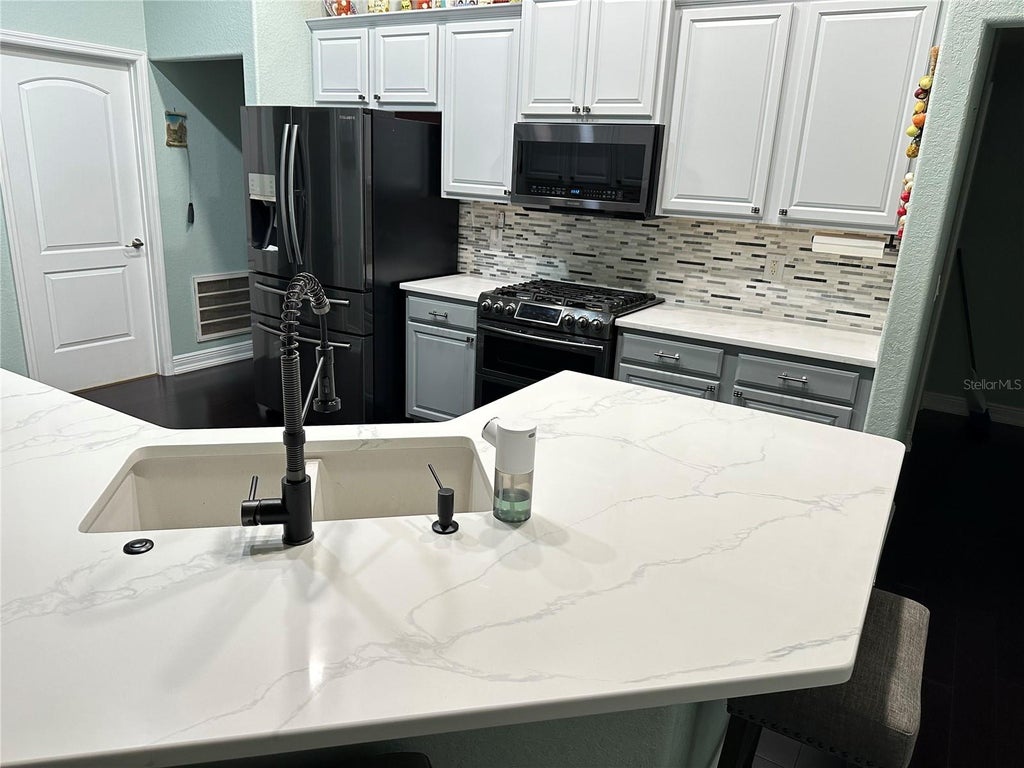 Photo of 1555 Blue Sky Boulevard, Haines City, FL 33844 (MLS # TB8544728)