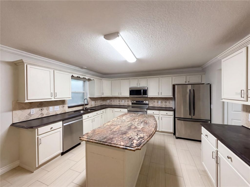 Photo of 3312 White Blossom Lane, Clermont, FL 34711 (MLS # O6413059)