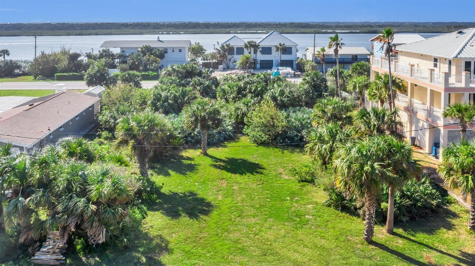 Great lot in desirable Bethune Beach with potential for ocean and river views. Property has access from both Turtlemound and South Atlantic Avenue. Beach access nearby on the no-drive beach. Close to JB's Fish Camp and Canaveral Seashore. City water and sewer are available. Owner has potential floor plans available. Cleared: partial.