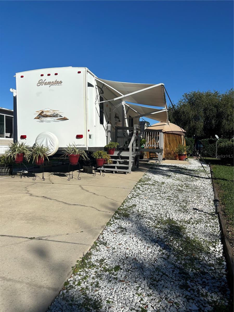 Experience the Florida lifestyle! This large lot in the Wilderness Town Park features a new 12'x8' shed. Please note that you own the land, not rent. Amenities include a pool, hot tub, fitness center, access to the Ocklawaha River, fishing, shuffleboard, and hiking trails on the Florida Greenway. The community is gated, and the HOA covers the community pool, grounds maintenance, private roads, sewer, trash, and water services. Situated in the desirable Wilderness Town Park, you will be just minutes away from Silver Springs State Park, shopping, restaurants, and historic downtown Ocala. East coast beaches are approximately one hour away. Please note that you can purchase the lot with 40’ Hampton Destination Trailer that was recently remodeled in 2023 and roof resealed in 2022 for $89,900.