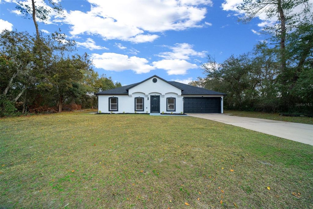 Photo of 497 Marion Oaks Lane, Ocala, FL 34473 (MLS # OM717403)
