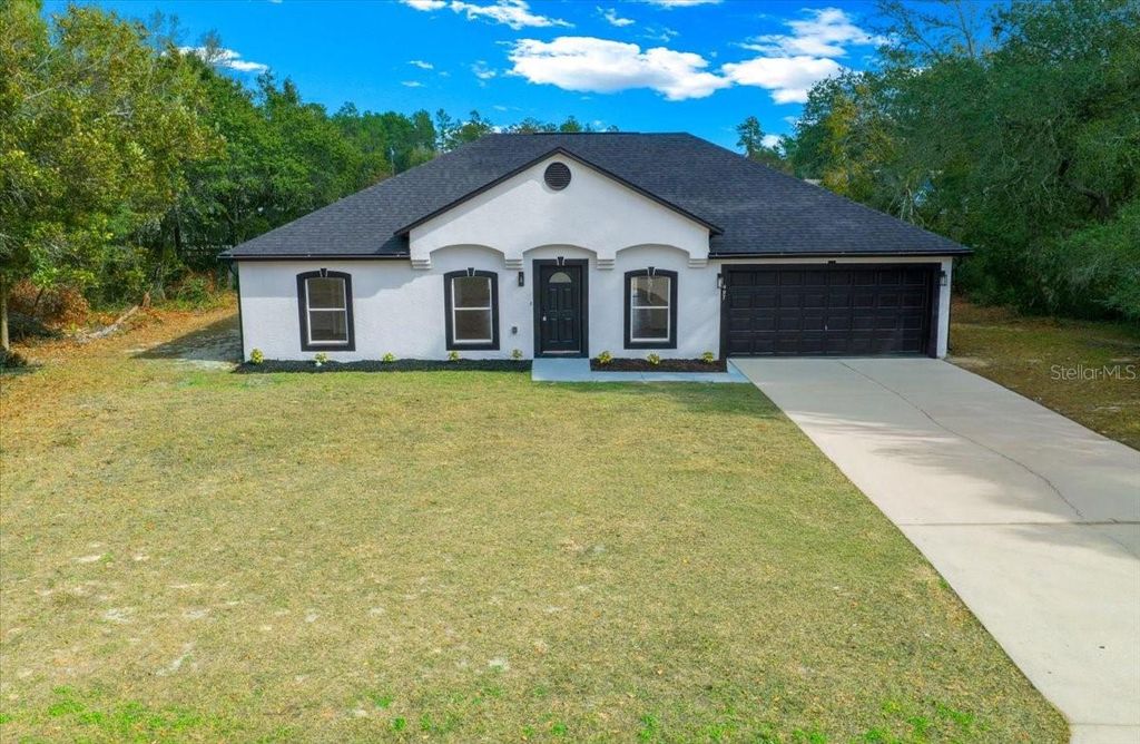 Photo of 497 Marion Oaks Lane, Ocala, FL 34473 (MLS # OM717403)