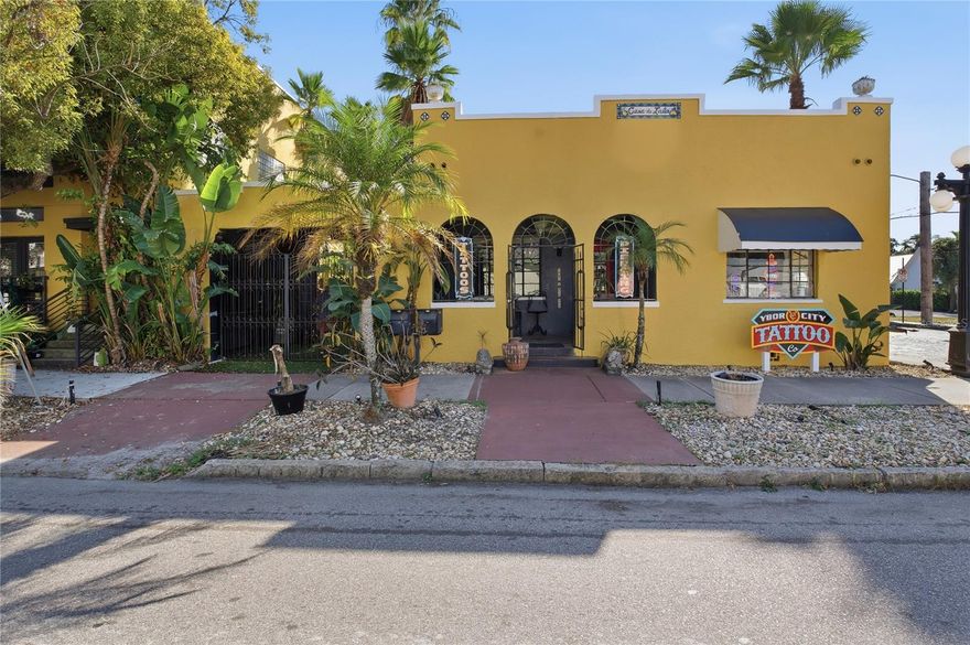 A rare one-of-a-kind piece of Ybor City's vibrant and historic commercial real estate. Centrally located directly on the corner of E 5th Ave and 19th St, this stand-alone building has versatility for creative, retail, or office use. Its mixed-use zoning offers exceptional flexibility for an owner-occupant or investor looking to capitalize on Ybor City's booming future. The interior is thoughtfully partitioned into several distinct, well-appointed rooms; perfect for private offices, studio spaces, treatment rooms, or individual retail sections. 
The property boasts a covered front archway entrance and spacious outdoor seating. Featuring a covered deck area, outdoor bar, fountain, OFF- Street parking and tropical plantings!
The property is situated in a high-traffic area, minutes from Downtown Tampa, Channelside, and walking distance from the Gasworx Tampa Project.
This is a turn-key opportunity for an entrepreneur in a creative or professional field, offering an exceptional blend of historic charm, modern functionality, and premium location.
