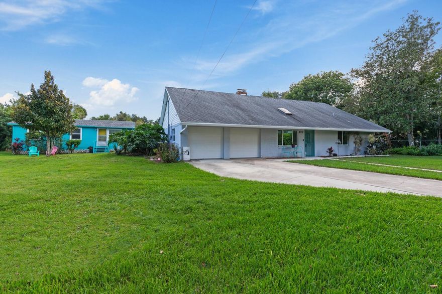 Unbelievable find - Two homes on 1 Acre, right in the heart of Port Orange, & ENTIRE ACRE IS FENCED ! Main house has 3 bedrooms, 2 baths with 1,898 sq. feet of living space. Separate cottage has 2 bedrooms, 1 bath with 576 sq. ft. of living, for a total of 5 BEDROOMS AND 3 BATHS. Main home has a living room with fireplace, plus large family room with sliding barn-doors. Big eat-in kitchen with sun tunnel for lighting. Island is free-standing and can be removed. Large master suite with newer wood-look laminate floors. All flooring is either tile or laminate-No Carpet! Indoor laundry. Large, party-sized, screened lanai. Cottage is cute as a button with bathroom being remodeled, and separate laundry facilities as well. New Solar Water Heater and A/C Unit with ultraviolet filter in 2020!  The enire main-house has Rainsoft water softener which was installed in 2018. Back yard is nice and flat and surrounded by shrubs and other greenery for total privacy. Plenty of space for your toys, workshop, pool, you name it. Two double gates - one at front of main home leading to concrete driveway and parking, and one in front of the cottage. Cottage still has original wood floors from the 50's. Kitchen could use some updating. Cooled by window units only, and has a wall heater. And, NO HOA! Cottage can be used for extended family, or rented out for extra income (It has separate electric meter, but just one water meter). This is a property that doesn't come along every day. And, who doesn't love everything Port Orange and Daytona Beach has to offer? Currently zoned as single family. Cottage is grandfathered in. ;Water: City