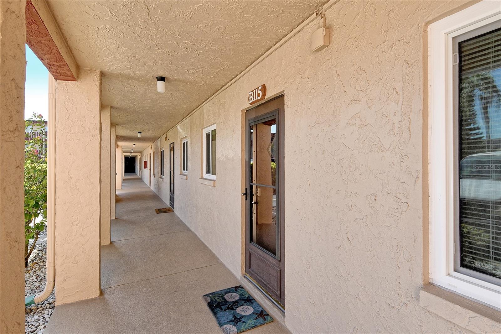This spacious 2-bedroom, 2-bath residence is located in the sought-after 55+ community of Bayshore on the Lake. Perfectly situated on the ground floor of a 3-story building, this home offers comfort, convenience, and easy access to the best of Florida living. Just minutes from world-renowned beaches, dining, shopping, airports, and more. Inside, a bright, open layout is enhanced by thoughtful updates throughout. The kitchen features rich wood cabinetry, granite countertops, and flows seamlessly into the main living space, where durable vinyl flooring adds a modern touch. Both bathrooms have been stylishly remodeled, and the home includes tile flooring in the baths and plush carpet in the bedrooms for added warmth and comfort. The unit is ideally located just steps from the shared laundry room and close to community amenities including a sparkling heated pool, clubhouse, and shuffleboard courts, perfect for enjoying the Florida lifestyle. Offered at a price that reflects both its prime location and recent improvements, this home is move-in ready with plenty of potential to personalize. Whether you're seeking a full-time residence, seasonal getaway, or investment opportunity, this condo presents an exceptional opportunity in a well-established and centrally located community.