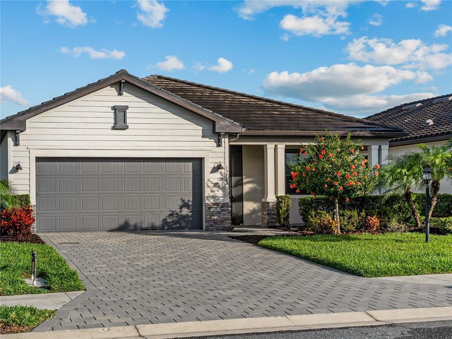 PRICED TO SELL! Welcome home to the popular Venice model, with the most gorgeous lakeview! This home features three bedrooms and three baths with an extended screened in lanai! Located in the amenity rich, gated, multi generational family neighborhood of Lorraine Lakes. This home has an open floor plan with a huge kitchen island with seating for three, a large walk in pantry, granite countertops, stainless steel appliances, a gas range, shaker style cabinetry with pendant and recessed lighting. The primary suite has views of the lake, two walk-in closets and a huge primary bathroom with dual sinks, a private water closet and a giant step in tiled shower. All the bedrooms and the living room have ceiling fans and blinds. Bedroom number 2 has its own en-suite bathroom! Bedroom 3, may also be used as your office or den! There is also a third full bath in the hallway next to the oversized Linen closet. The garage has a painted floor, Tankless water heater and extra storage on the ceiling. The entry to the front door has been screened in so you can keep the light on with no bugs! Enjoy relaxing in the morning or evening on the extended screened in lanai, while watching all the wildlife and fish in the lake. The yard is large and can be fenced and definitely can handle a pool! The amenities available to you in this community are out of this world! The clubhouse has a resort style pool, a lap pool, a kiddy splash park, Tennis, Pickleball, Basketball, bocce ball courts, Indoor basketball, sand volleyball, An indoor and outdoor Restaurant with 2 bars! All of this as well as an amazing community that loves to attend all the events planned for you by the Lifestyle Director! Make your appointment today to see this lovely home before it is sold!