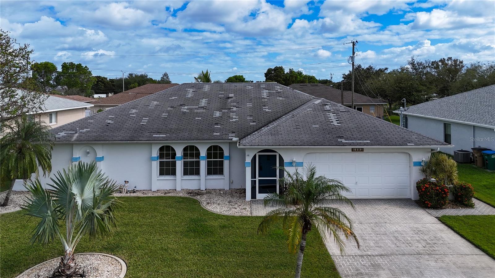 New roof completed March 2025. Flood Zone X500. Come and see the Florida living at its best. With the oversized pool, fenced area for your favorite pet. The massive under truss lanai will handle all your outdoor meals and has room to entertain. The under truss lanai measures 14' X 34'. This 3 bed two bath home is a tad over 2000 sq ft. The electric panel is a Square D, the water is supplied by a high end Manabloc system. The AC was updated in 2024 and the home comes with a full set of Aluminum (easy to handle) storm shutters. You can still pick colors for the new roof !!! Favorable flood zone X500.