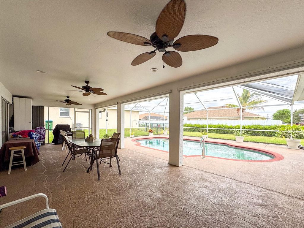 Photo of 1403 SE 8th Place, Cape Coral, FL 33990 (MLS # C7513456)
