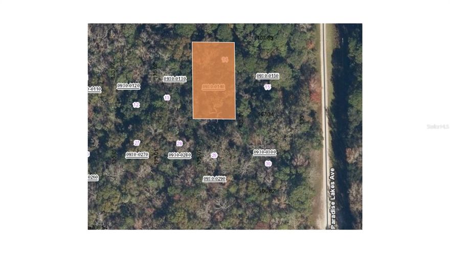 Located in the peaceful community of Paradise Lakes, 127 Jay Avenue in Georgetown, Florida, offers a prime opportunity for those seeking a slice of the Florida lifestyle. This approximately 0.23-acre (10,105 sq. ft.) lot is situated on a quiet, dirt-surface road and is surrounded by lush, mature trees, providing a high degree of privacy and a "nature lover's paradise" feel. $60/yr fee includes the use of the private boat ramp, BBQ areas, and a playground, allowing you to easily launch your boat and spend the day on the lake without the hassle of public ramps