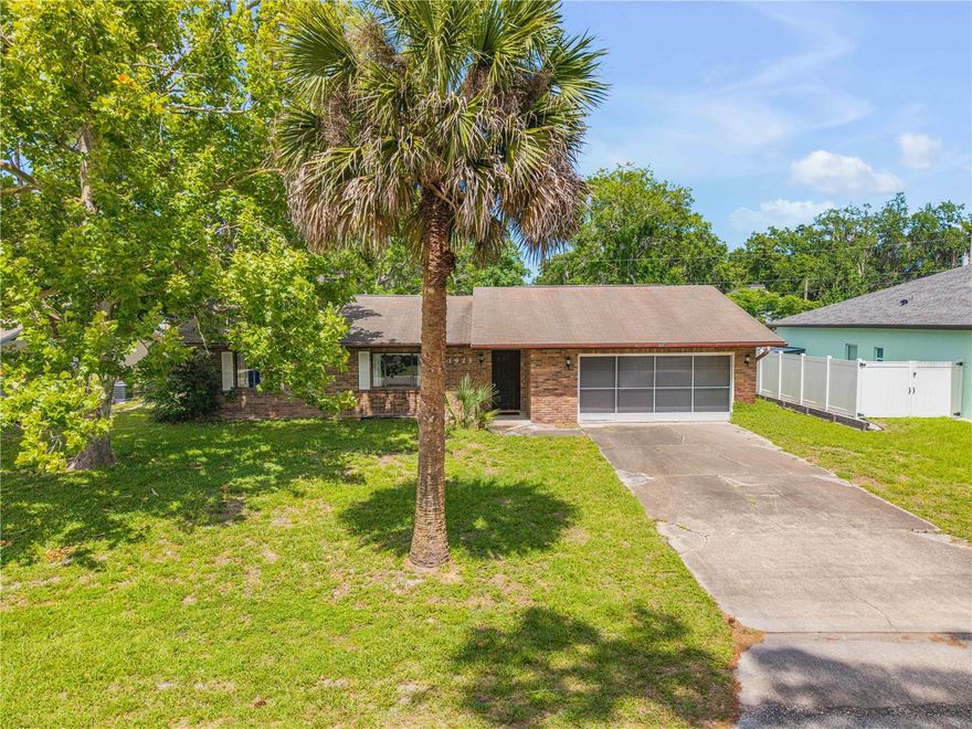 Located in the Florida Shores community of Edgewater, this well-maintained concrete block home offers 3 bedrooms and 2 bathrooms with a desirable split floor plan that provides a functional living space. The kitchen features generous cabinet storage with convenient pull-out drawers, offering ease of use. Enjoy a screened-in patio that extends the living area and an oversized yard with plenty of room for entertaining, gardening, pets, or future outdoor improvements. With no HOA restrictions, you have the freedom to truly make the property your own. Florida Shores is a well-established neighborhood close to the Indian River, local parks, boat ramps, shopping, and dining, with convenient access to both New Smyrna Beach and Daytona Beach, offering an ideal location for enjoying beaches, waterfront recreation, and a relaxed coastal Florida lifestyle. Information provided is deemed reliable but is not guaranteed and should be independently verified by buyers and buyer’s agent.