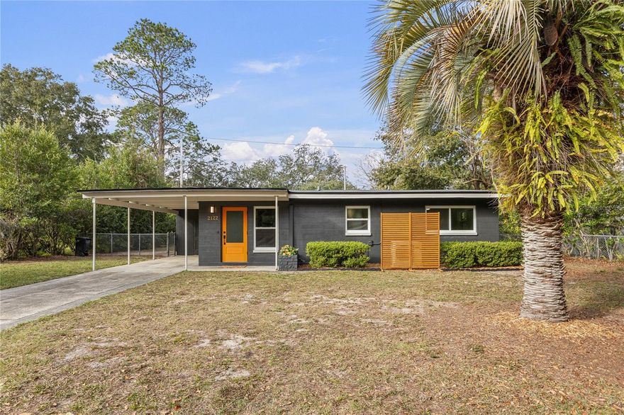 This beautiful, completely renovated Mid Century Modern less than 3 miles from the University of Florida, in the Carol Estates North community is ready for its new owner! Step into the spacious living room and see 1 of 3 gorgeous Pecky Cypress walls, a high end upgrade. Then walk into the dining room and turn the corner into a brand new, stylish kitchen (Nov 2025). The chef in the house will love the custom, all wood, soft close cabinets, gleaming quartz countertops, and a suite of stainless steel Samsung appliances. This mid-century modern concrete block home also has been completely repainted inside and out and it has new interior and exterior doors! The roof and HVAC (3 head, ductless mini split for great energy efficiency) were replaced in October of 2025. New energy efficient, double pane windows were installed in November 2025. Honoring the home's history, the original built-in bedroom closets remain and the terrazzo floors throughout the home have been lovingly restored and are a treasure. Both bedrooms are large but the primary bedroom, with the built-in closet, is so large that a king bed, 2 nightstands and even a desk and large chair fit with plenty of room to maneuver around. The backyard is totally ready to entertain. Thousands of dollars worth of custom brickwork, tons of vegetation for privacy and a new fire pit area provide the backdrop for plenty of outdoor enjoyment for just yourself or if you love to entertain. The screened in patio is a flashback with its angled frame. Such a cool vibe. This house just needs you to bring your personal belongings and start living! The electrical panel was upgraded to a 200amp panel, kitchen waste arm was replaced, the home hot water heater is from 2021, and the house hot was re-piped in 2015. Such a great location on a quiet street. Just blocks from Gainesville’s iconic Satchel’s Pizza and the hip and trendy Public and General restaurant. In 1-2 miles, you will find Tom Petty Park, Smokey Bear Park and a wonderful Alachua County Library Branch. Less than 3 miles to downtown Gainesville, University of Florida and UF Health/Shands or the VA hospital. Call us to schedule your tour today!