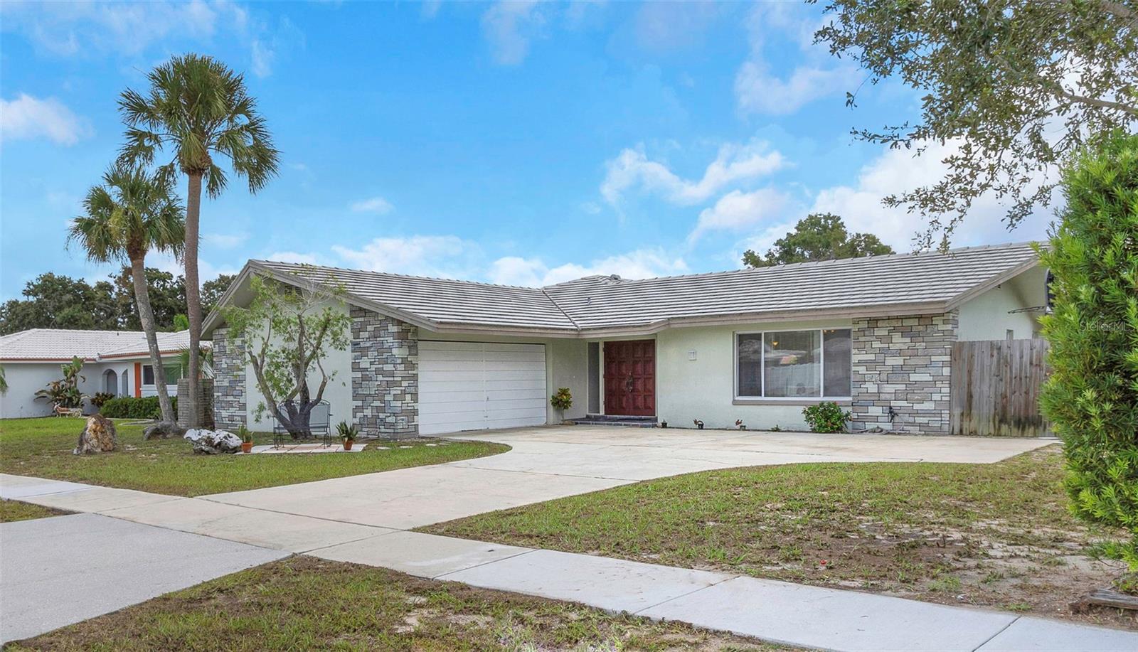 **Now with Brand NEW TILE ROOF and warranty INCLUDED at Closing!! (as of 9/9/2025)**
5 BR/3 BA/2 CG 2712 SF pool home on nearly 1/3 acre just 5 minutes to the Gulf beaches yet tucked inside a non flood, non-evacuation zone!
*Includes:
-All new Luxury Vinyl Plank flooring throughout!
-complete interior repaint!
-updated bathrooms!
-refinished countertops!
-and a freshly resurfaced pool deck!
As you step inside, you'll find a versatile split bedroom floor plan with a large living room, expansive eat-in kitchen and a massive great room with soaring ceilings, and a cozy wood burning fireplace.
Step outside to a gorgeous screen enclosed pool with heated jacuzzi/spillover spa – perfect for outdoor living and relaxing in style. The over sized 2 car garage, extra large laundry room and spacious backyard offer plenty of storage space. There’s even room for a boat or RV! Located in a walkable neighborhood with a nearby elementary school, you’ll love the convenience of being close to restaurants, stores, medical facilities and the airport. Whether you’re raising a family or looking for a one-level retreat, this home has it all.
Don’t miss your chance to own this dream home in a fantastic community!
Owner is a Licensed Real Estate Broker
For Home Owners Association and Deed Restriction details visit: hillcrestmanorhoa.org