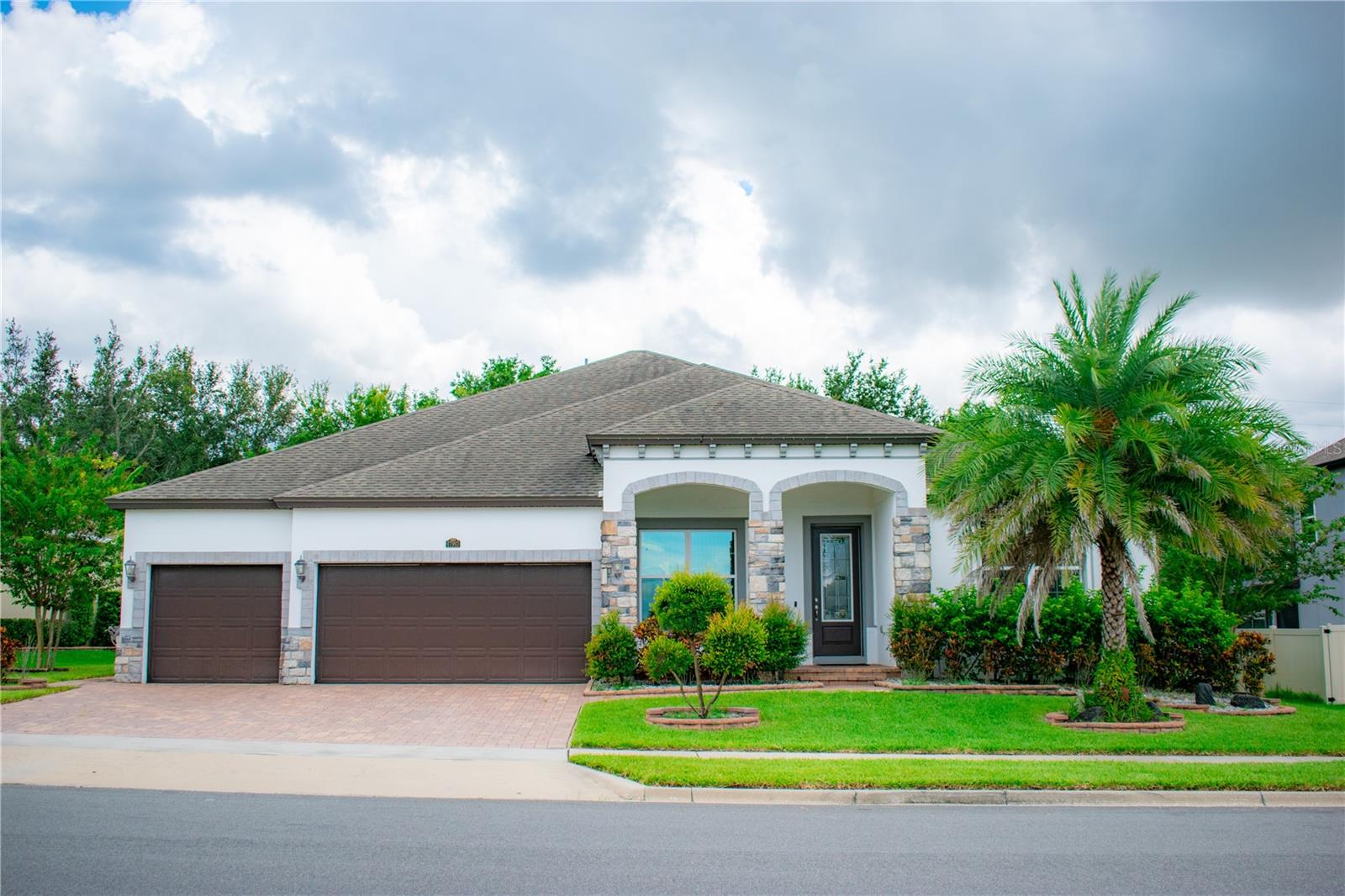 Come see this exquisite Meritage Home in Winter Garden’s VERDE PARK, sitting on a 1/4 acre lot. This residence features 4 bedrooms, 3 full bathrooms, a bonus room, a 3-car garage, and an expansive rear stone patio with screen enclosure. This one-story masterpiece boasts an open concept with a gourmet kitchen, perfect for hosting and entertaining guests. This home has had many upgrades, including a custom fireplace in the living room, Crown molding, and a custom 2-pillar entrance to the master bedroom. A brand new A/C unit was installed in 2024. Don't miss out on the opportunity to own this stunning home. Conveniently located near the Florida Turnpike, 429, and 408, ensuring an easy commute to Orlando, local attractions, and the airport. Close to amazing shopping and dining options in Winter Garden, Clermont, as well as top public and private schools, parks, hospitals, lakes, and steps away from the West Orange Trail. Call today to schedule a private tour.