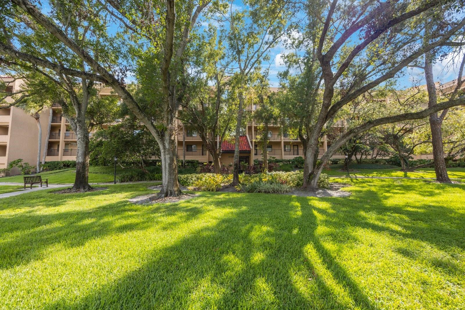 Welcome to this beautifully maintained 2-bedroom, 2-bathroom condo located in the highly desirable Imperial Pines community in Clearwater. This spacious 1,145 sq ft unit offers comfort, convenience, and peace of mind in a serene, park-like setting. Step into an inviting open-concept living and dining area with neutral tones, abundant natural light, and stylish plantation shutters. The split-bedroom layout provides privacy, while the Florida room offers the perfect flex space for a den, office, or reading nook. The kitchen features solid wood cabinets, ample counter space, and a full suite of appliances—including washer and dryer for your convenience. Ceramic tile and carpet flooring throughout keeps the space cozy and functional. Enjoy worry-free living with hurricane shutters on rear windows and covered, assigned parking with elevator access. Imperial Pines offers top-notch amenities including a heated pool, clubhouse, walking paths, and a secure gated entrance. Just minutes to shopping, dining, Countryside Mall, and world-famous Gulf beaches. Easy access to major highways and airports.