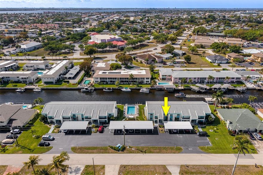 Check out this Gulf Access townhome offering sparkling water views and the perfect Florida getaway! This bright and airy home features an open living room and kitchen filled with natural sunlight. A convenient half bath downstairs, extra storage, and a laundry closet on the lanai. Upstairs, you’ll find two spacious bedrooms, including a large primary suite with a walk-in closet and private bathroom, as well as a guest bedroom with its own private bathroom. Enjoy peaceful mornings and relaxing evenings on the oversized lanai watching the boats go by. Boating enthusiasts will love the Gulf access with dock space available on a first-come, first-served basis, and only one bridge and short stroll to open waters. This home is being sold furnished and includes assigned covered parking, with additional guest parking available. Ideally located near downtown Cape Coral, shopping, dining, and just minutes to the bridge for easy access to Fort Myers. Whether you're looking for a move-in ready getaway or a place to add your own personal touch, this waterfront gem is ready to welcome you home!
