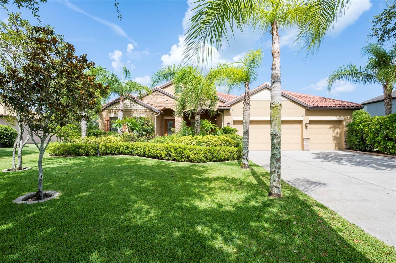 Step into this stunning 5-bedroom, 3-bathroom residence nestled on a spacious half-acre lot in the highly sought-after gated community of Toulon. This beautifully maintained home boasts curb appeal with a large, professionally landscaped yard and a classic Spanish tile roof. Inside, you’ll find an immaculate interior featuring elegant ceramic tile and rich hardwood floors throughout.
The thoughtfully designed floor plan includes a spacious kitchen with stone countertops, ample cabinetry, and a large island—perfect for entertaining. The home offers multiple living spaces including a cozy family room and a formal living room, ideal for both relaxing and hosting guests.
Retreat to the luxurious master suite complete with a spa-like bathroom featuring a garden tub, separate walk-in shower, and dual walk-in closets. The additional bedrooms are generously sized and filled with natural light.
Enjoy Florida living at its best on the screened-in lanai overlooking the expansive backyard. Other features include a 3-car garage, an irrigation system powered by a private well, and sidewalks throughout the community. The A/C unit was replaced in 2020 for added peace of mind.
Best of all, this home comes with NO CDD fees and offers unbeatable convenience—just 3.2 miles from I-75 and 4 miles from I-4, making your daily commute a breeze.