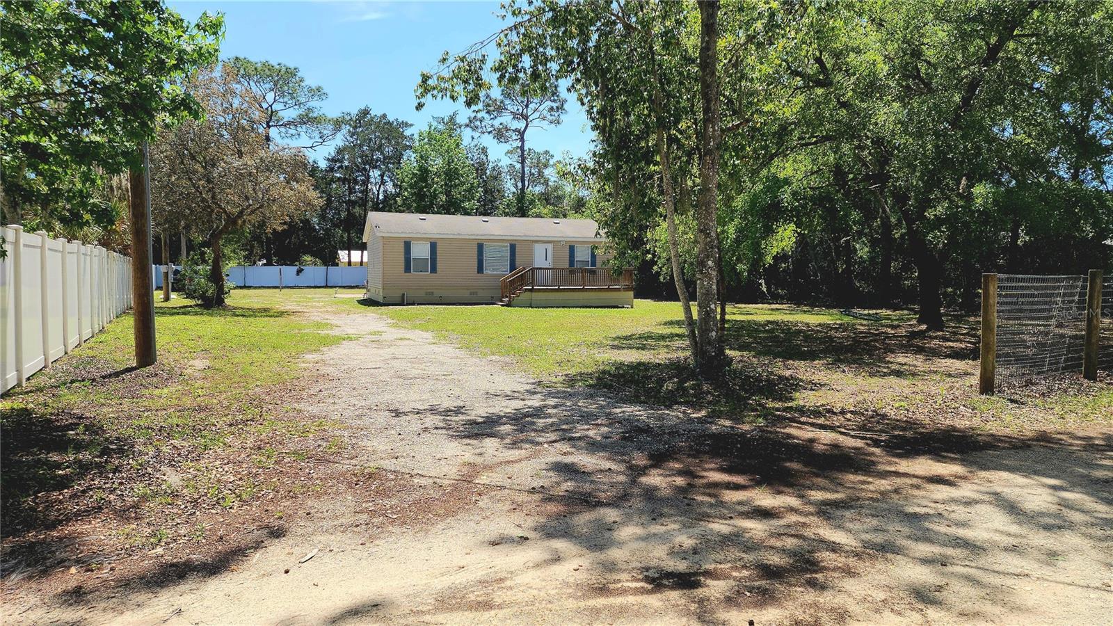Charming 3-Bedroom Home on Nearly Half an Acre in a Peaceful Country Setting
Discover this inviting doublewide home on a spacious 0.47-acre lot, perfectly nestled at the end of a quiet cul-de-sac. Built in 2014 and thoughtfully updated in the last two years, this home offers worry-free living with a new AC unit, new well and septic system, new appliances, and a freshly paved patio complete with a cozy firepit.
Step inside to an open-concept living area that combines the kitchen and living room, creating a warm space for gatherings. The kitchen includes newer appliances and flows conveniently into a laundry area with washer and dryer hookups.
With three bedrooms and two full bathrooms, there's room for everyone. The spacious primary suite features a large walk-in closet and a beautiful ensuite bath with a huge tiled shower. The second bathroom offers a tub and shower combo—perfect for guests or family.
Outdoor living shines here with two new decks (front and back), ideal for outdoor dining and relaxing. The mostly fenced yard—vinyl on two sides and metal on the others—just needs a gate to be fully enclosed for your pets. There’s also a private backyard area ready for your RV with 30amp & 50amp hookups plus water, and room to park your boat.
Currently enjoyed as a vacation retreat, this home is being offered with the option to negotiate some furnishings to stay. making it an easy turnkey getaway or a fantastic short-term rental investment.
You’ll love the location with so much to explore nearby: dine at waterfront favorites like Crumps Landing, visit the Homosassa Springs Wildlife State Park, kayak the crystal-clear springs of Crystal River, or treasure hunt at the famous Howard’s Flea Market just down the road.
Whether you’re looking for a peaceful primary residence, a weekend retreat, or a rental income opportunity, this property offers it all.
Schedule your showing today and start living the Florida lifestyle you’ve been dreaming of! CASH buyers only please.